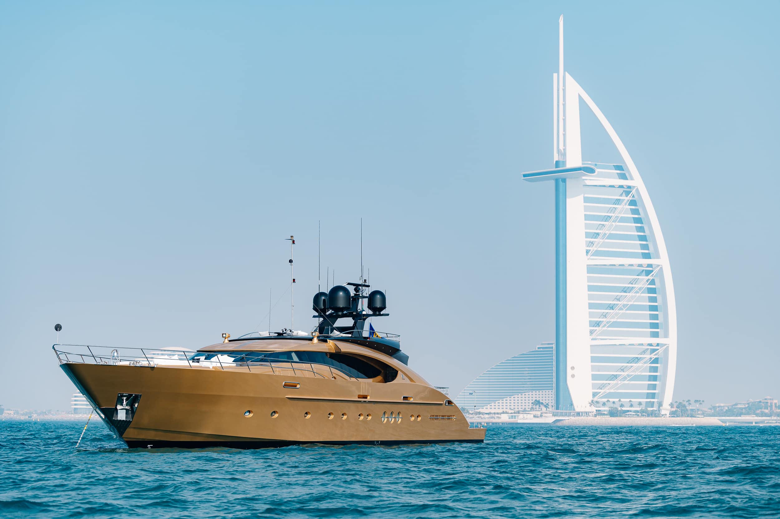 Royalty 136 luxury yacht cruising near Burj Al Arab in Dubai