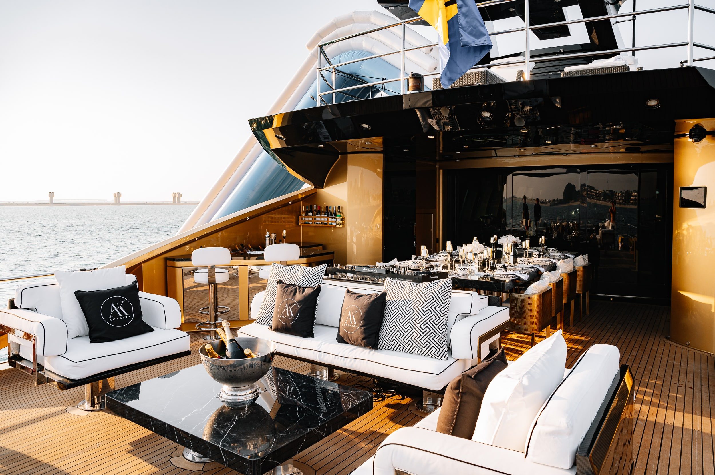 Outdoor lounge seating area on Royalty 136 luxury yacht