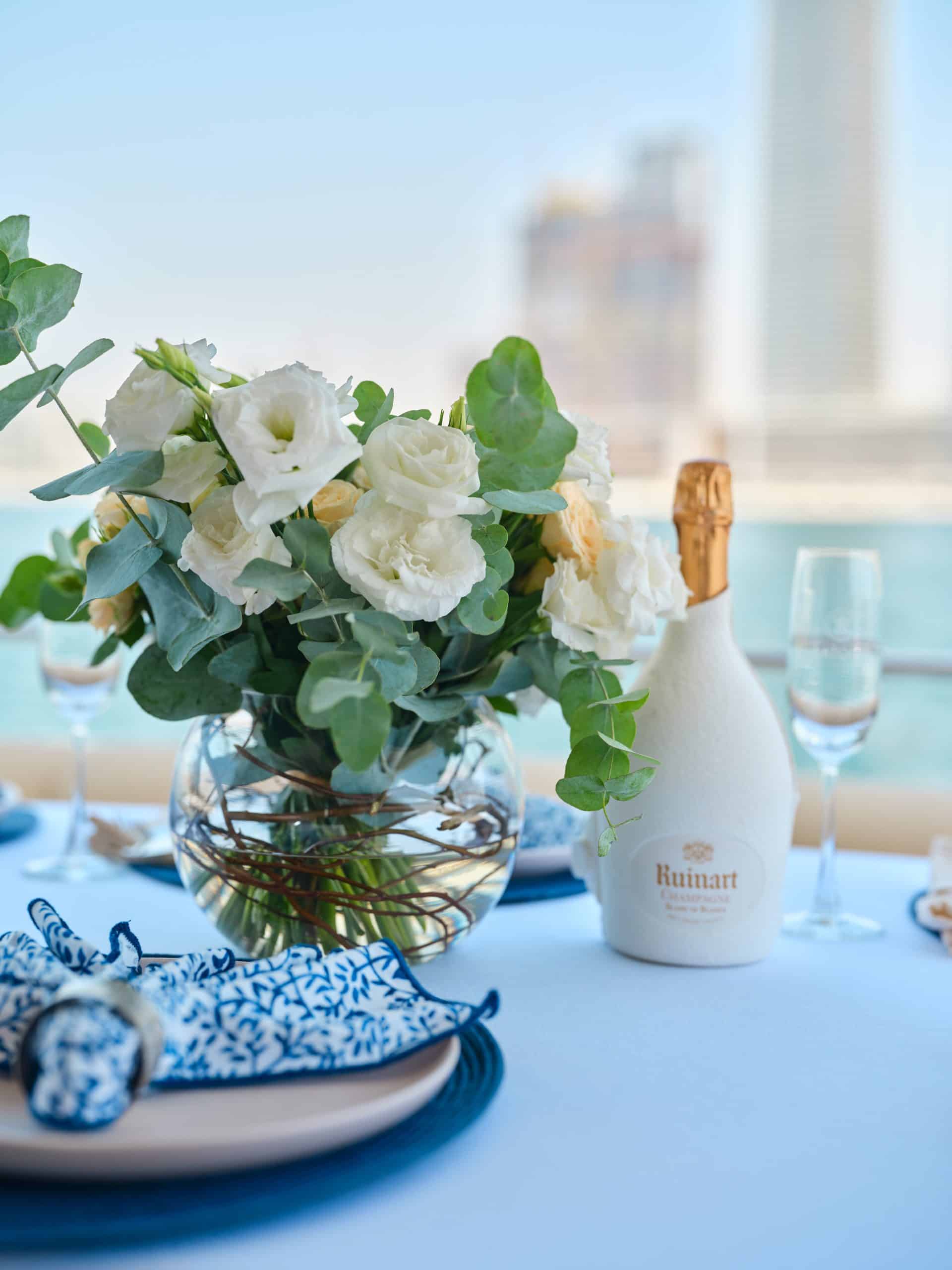 Elegant floral arrangement on dining table aboard Sunseeker Satoshi 70 yacht