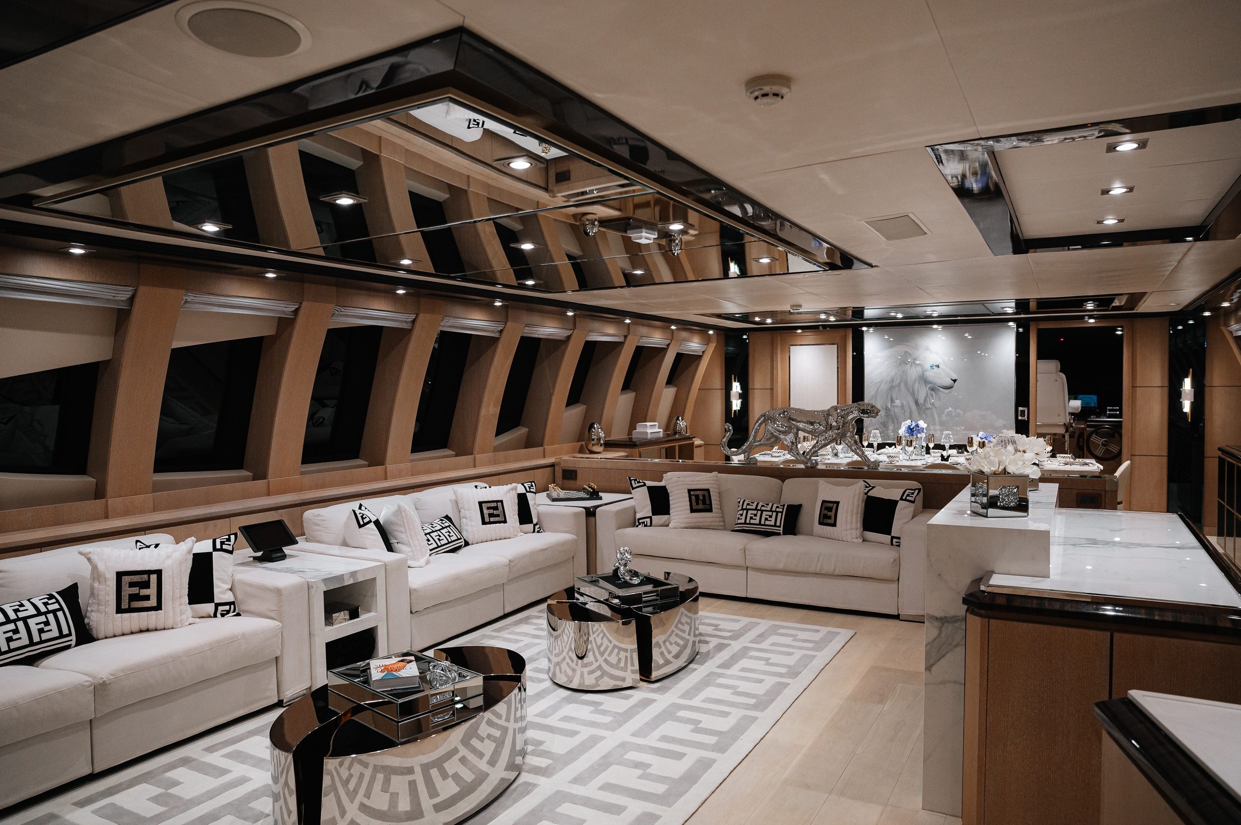 Royalty 136 yacht main salon with modern luxury seating and panoramic windows