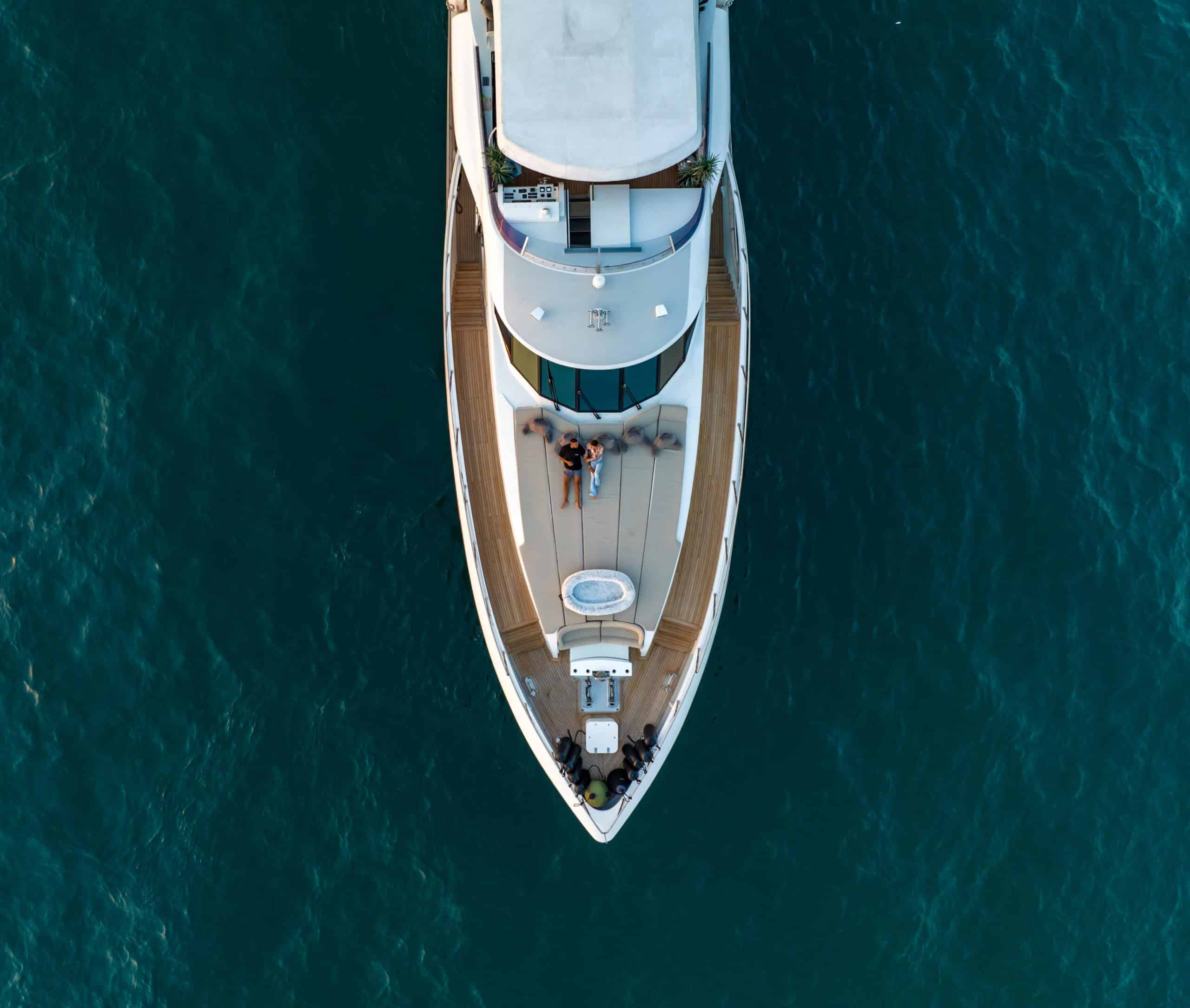 Aerial top view of Tatti 110 luxury yacht cruising Dubai waters