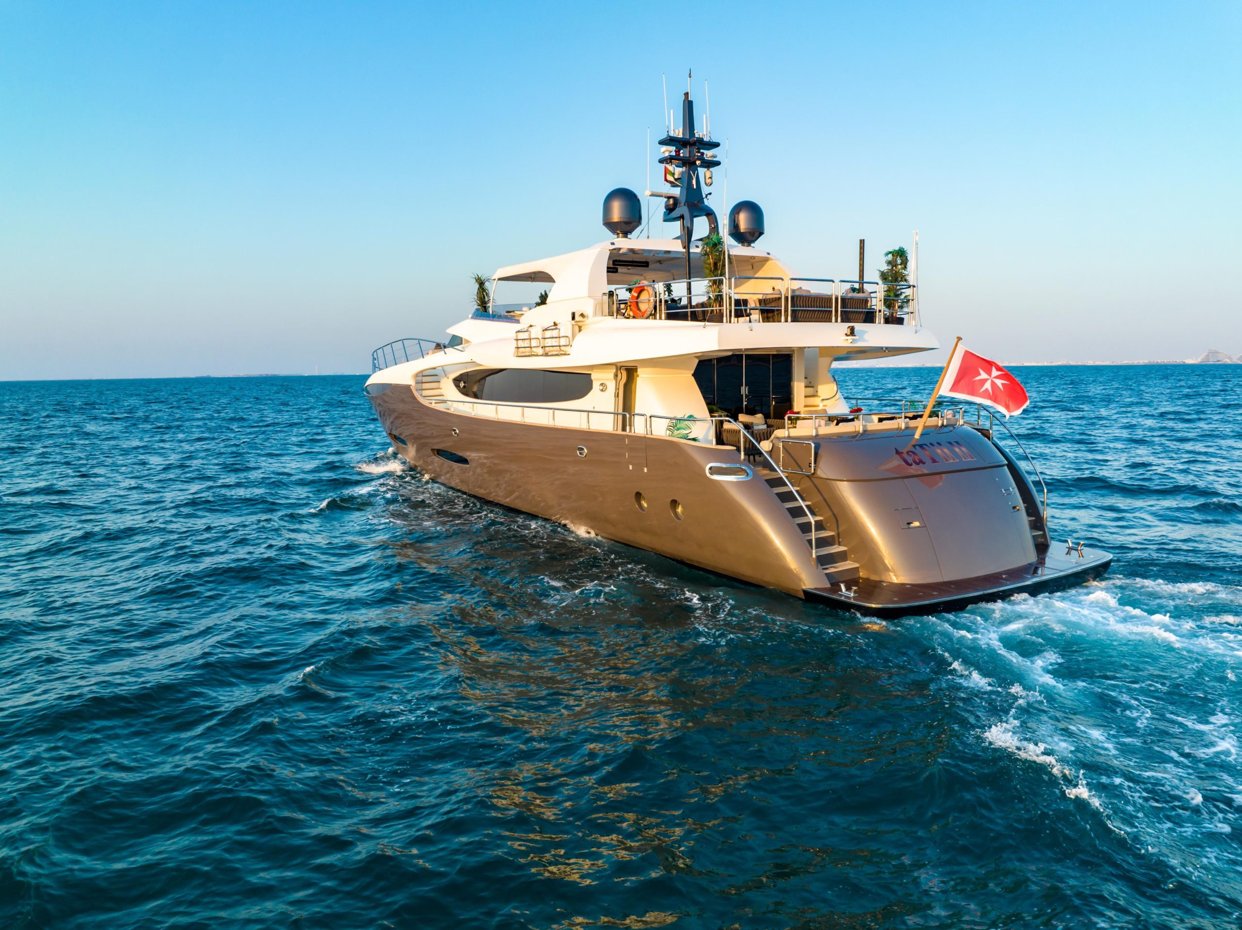 Exterior view of Tatti 110 luxury yacht cruising Dubai waters