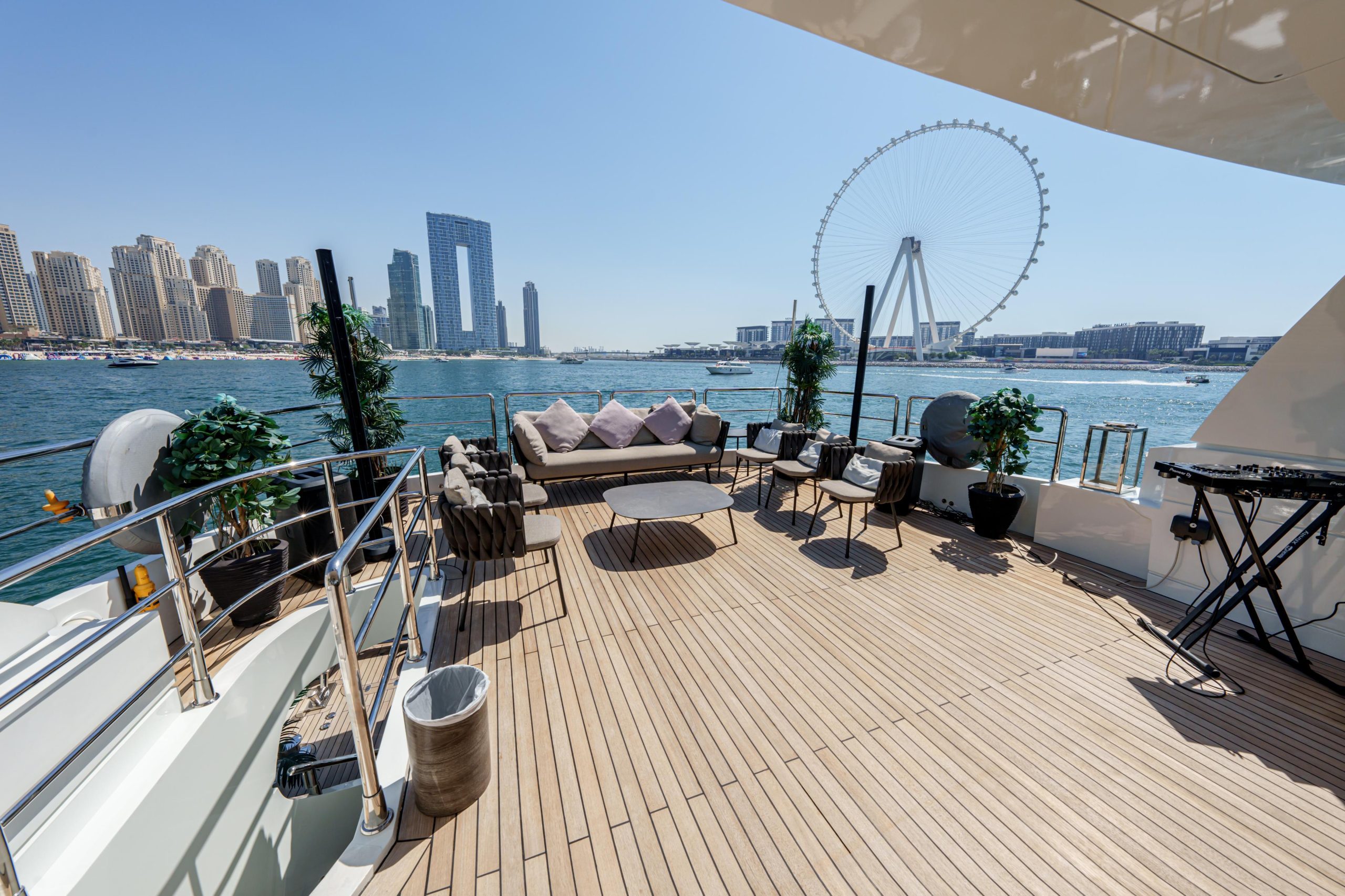 Front deck seating with Dubai skyline view on Tatti 110 yacht