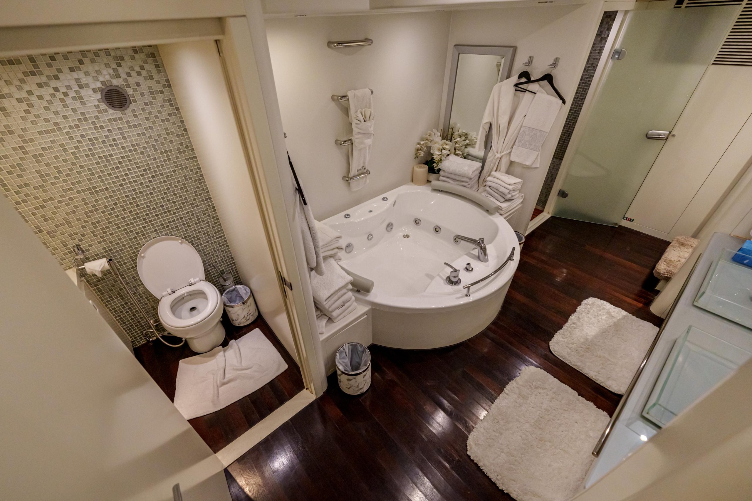 Bathtub and shower area in Tatti 110 yacht bathroom