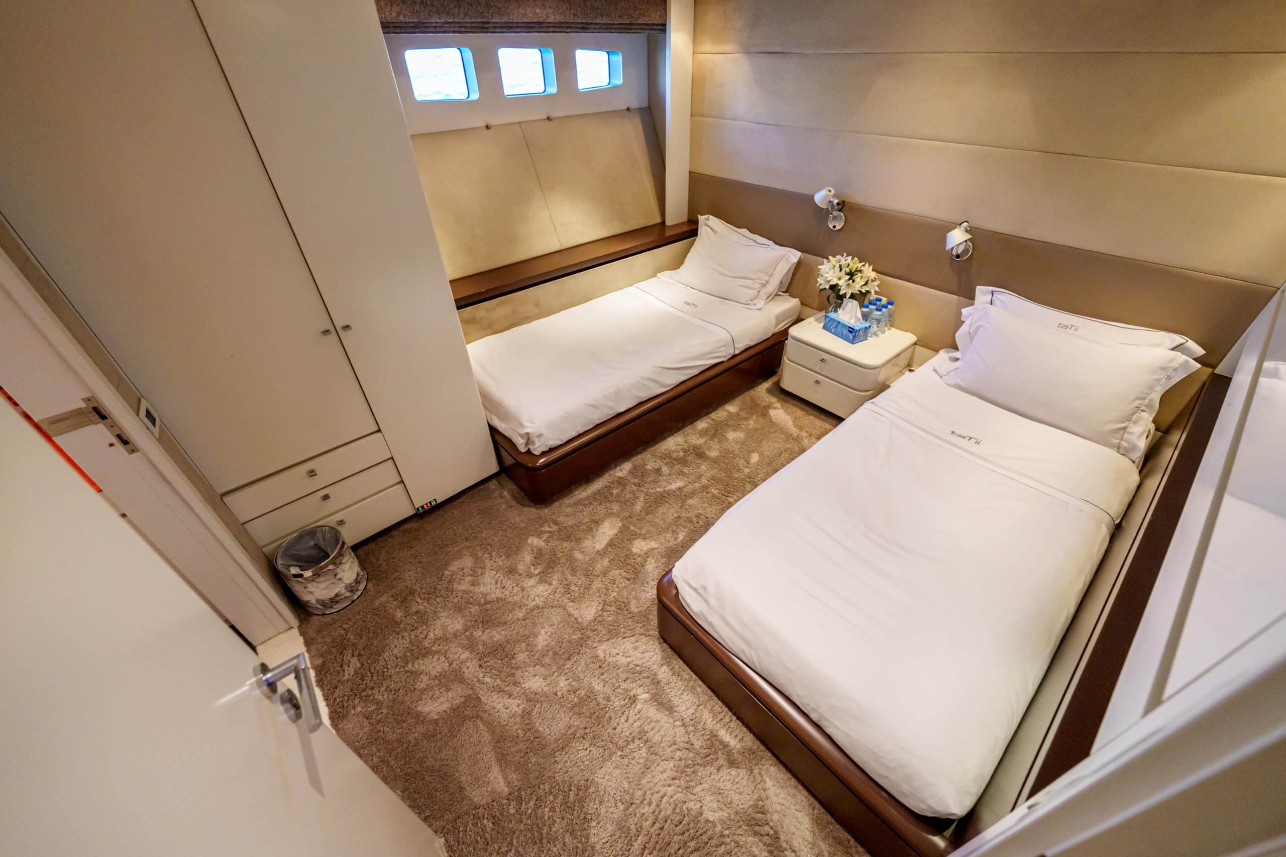 Twin guest cabin bedroom on Tatti 110 luxury yacht