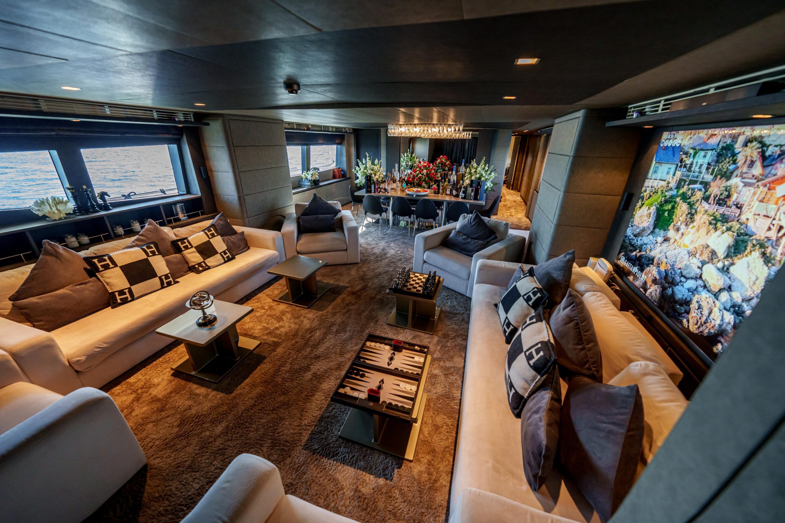 Premium yacht saloon with plush sofas on Tatti 110
