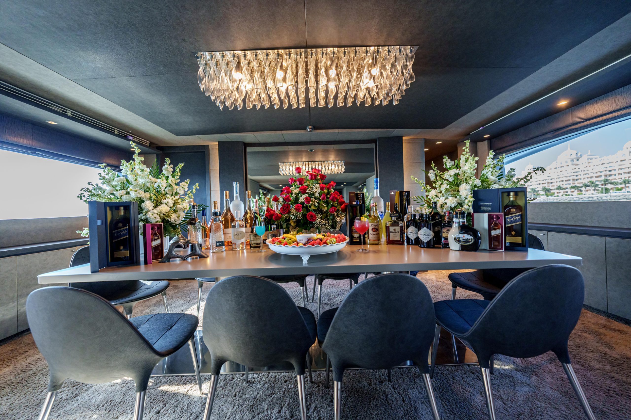 Sophisticated indoor dining area with floral centerpiece on Tatti 110