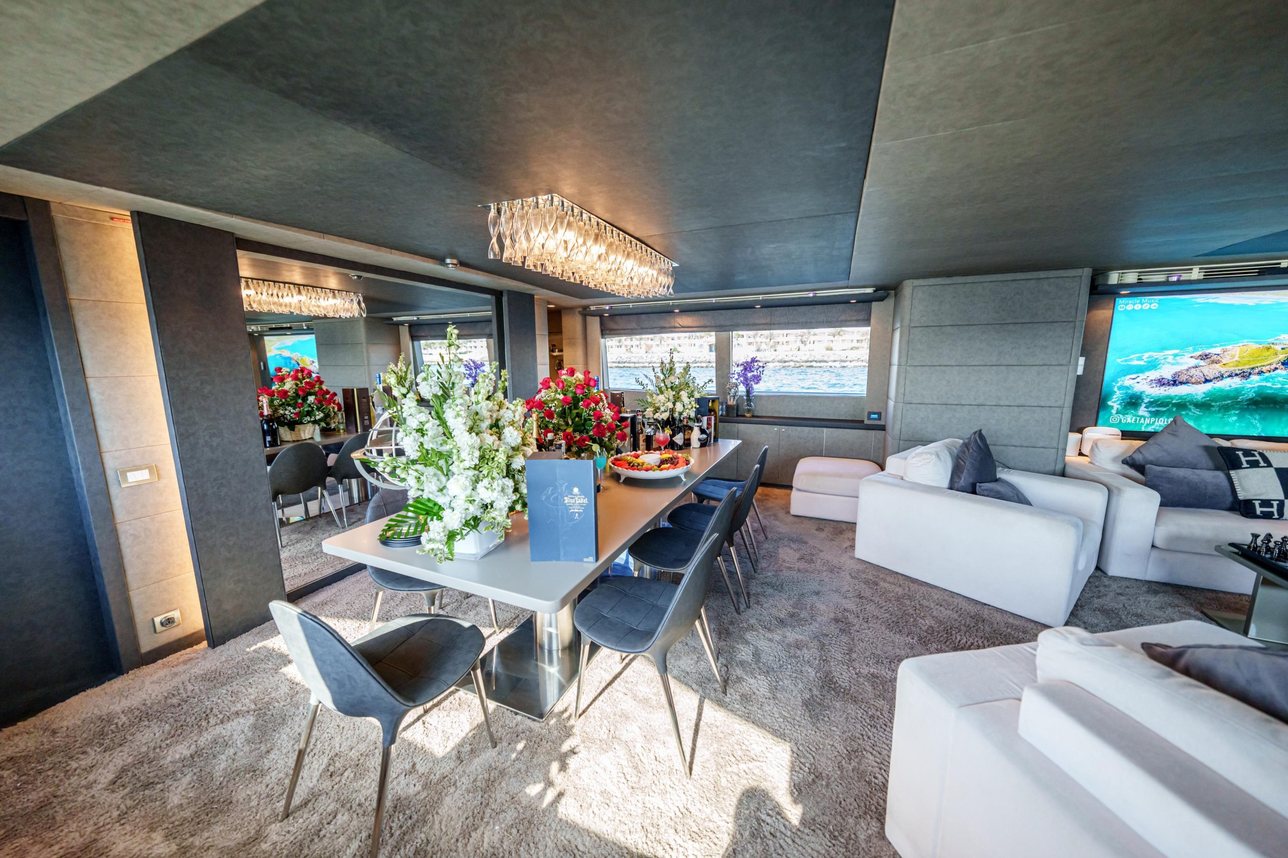 Luxury yacht interior lounge with modern decor on Tatti 110