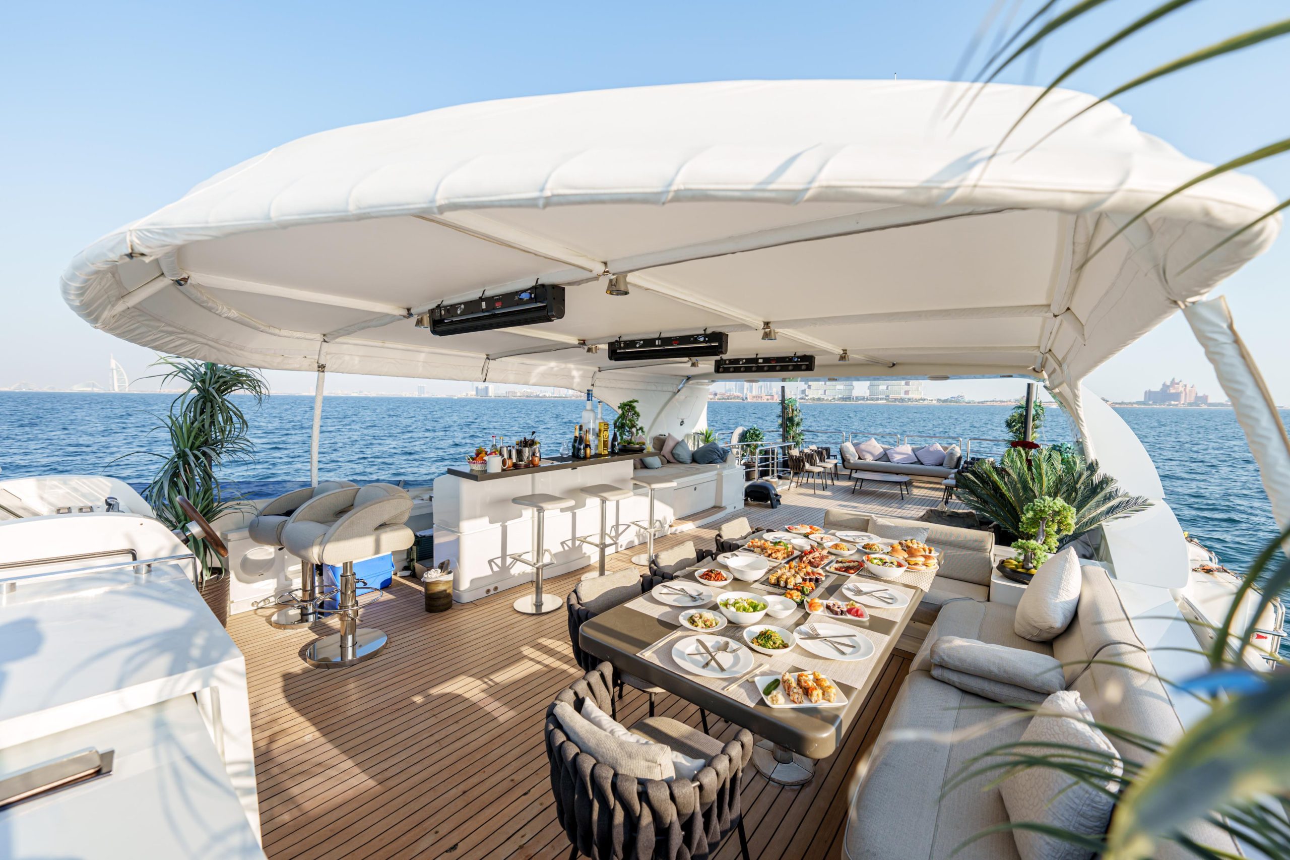 Elegant outdoor dining table setup on Tatti 110 luxury yacht