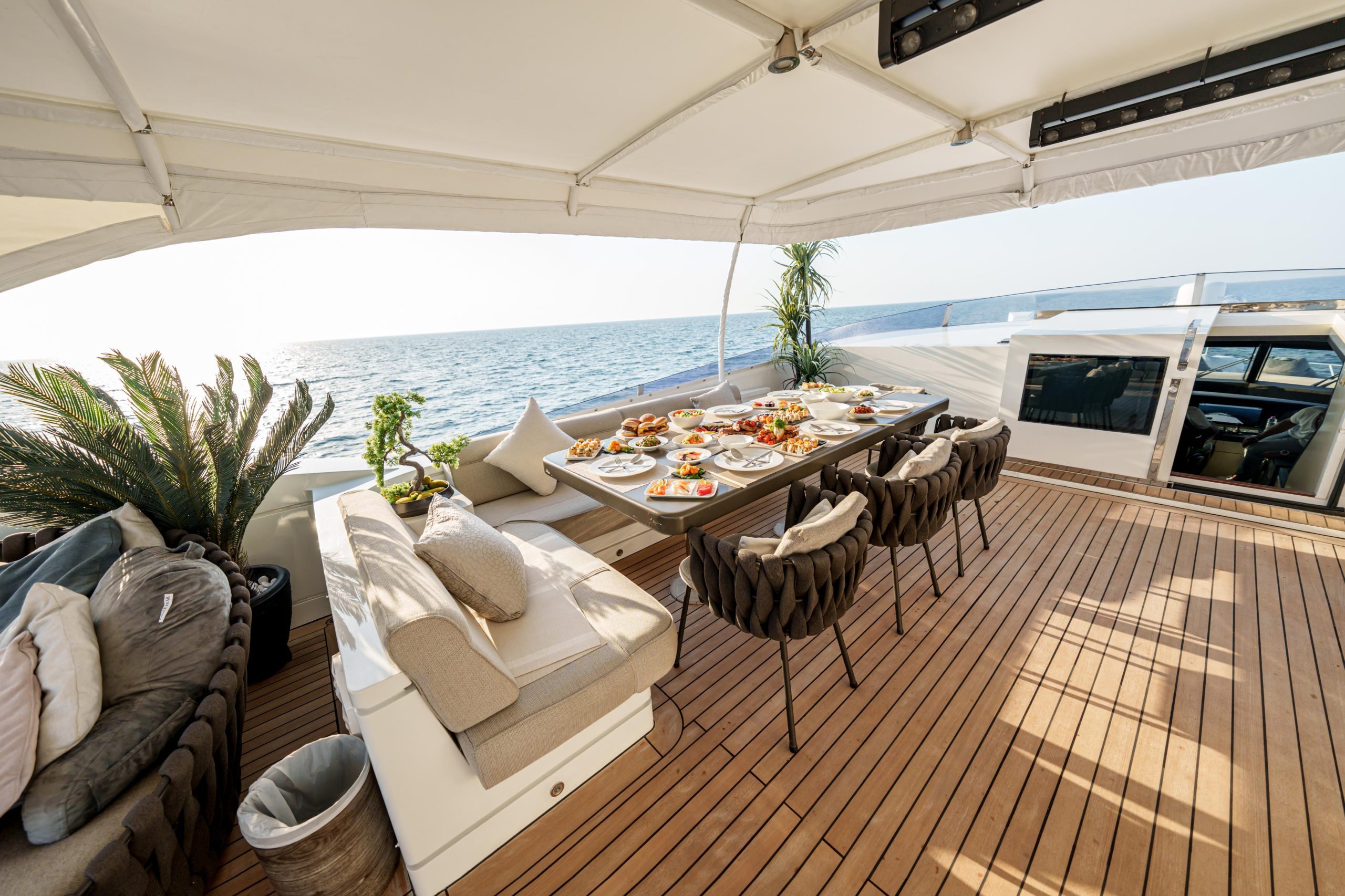 Spacious shaded lounge area on Tatti 110 luxury yacht