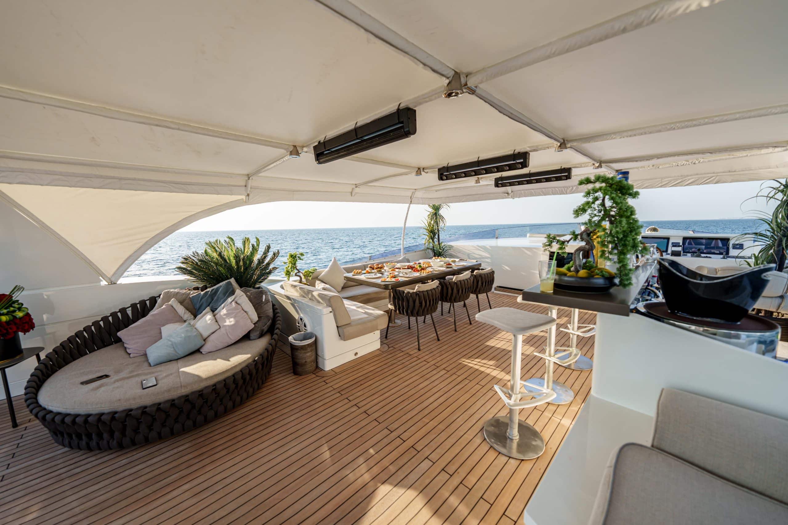 Premium outdoor seating and table setup on Tatti 110 yacht