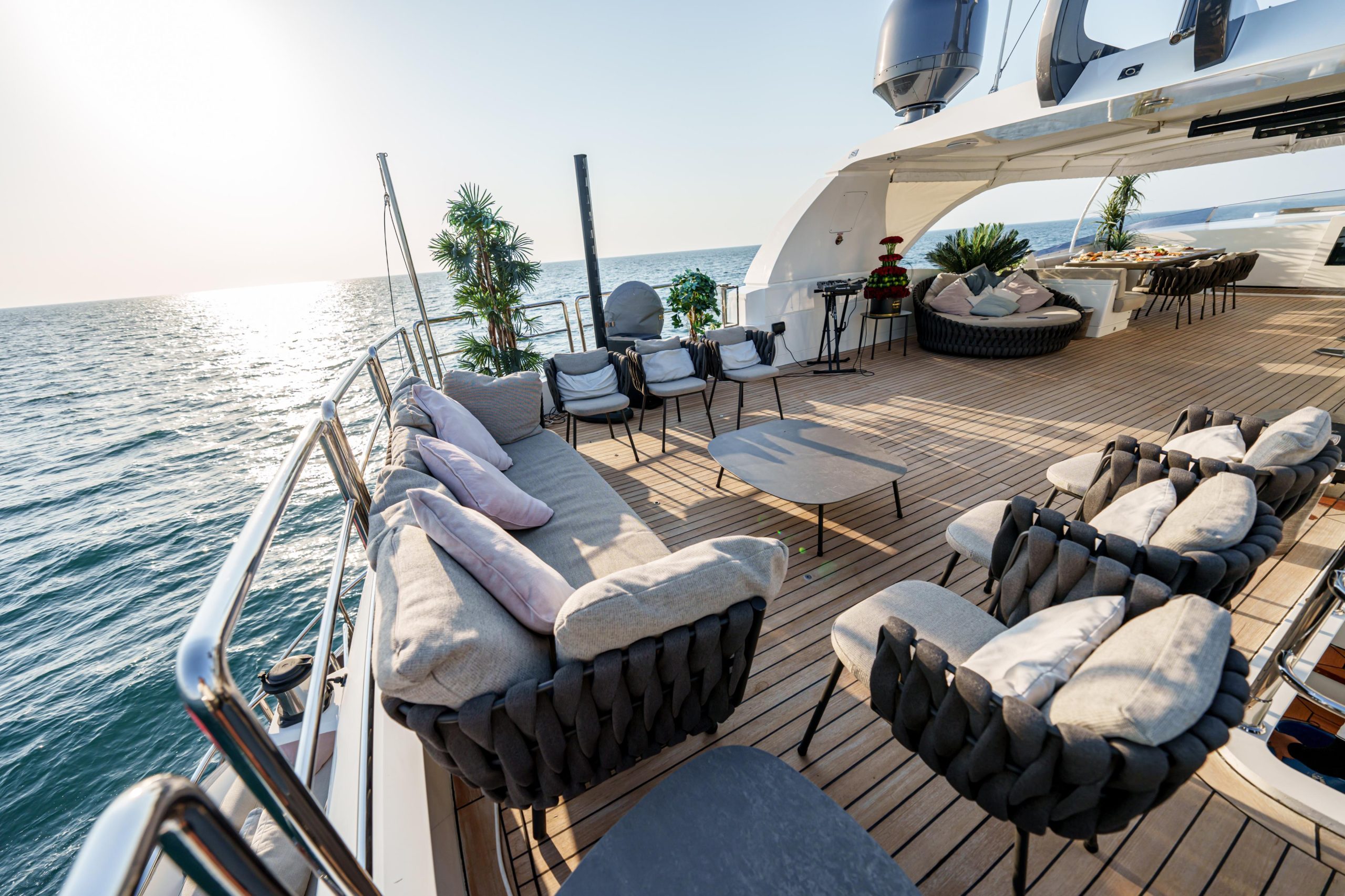 Stylish seating arrangement on upper deck of Tatti 110 yacht
