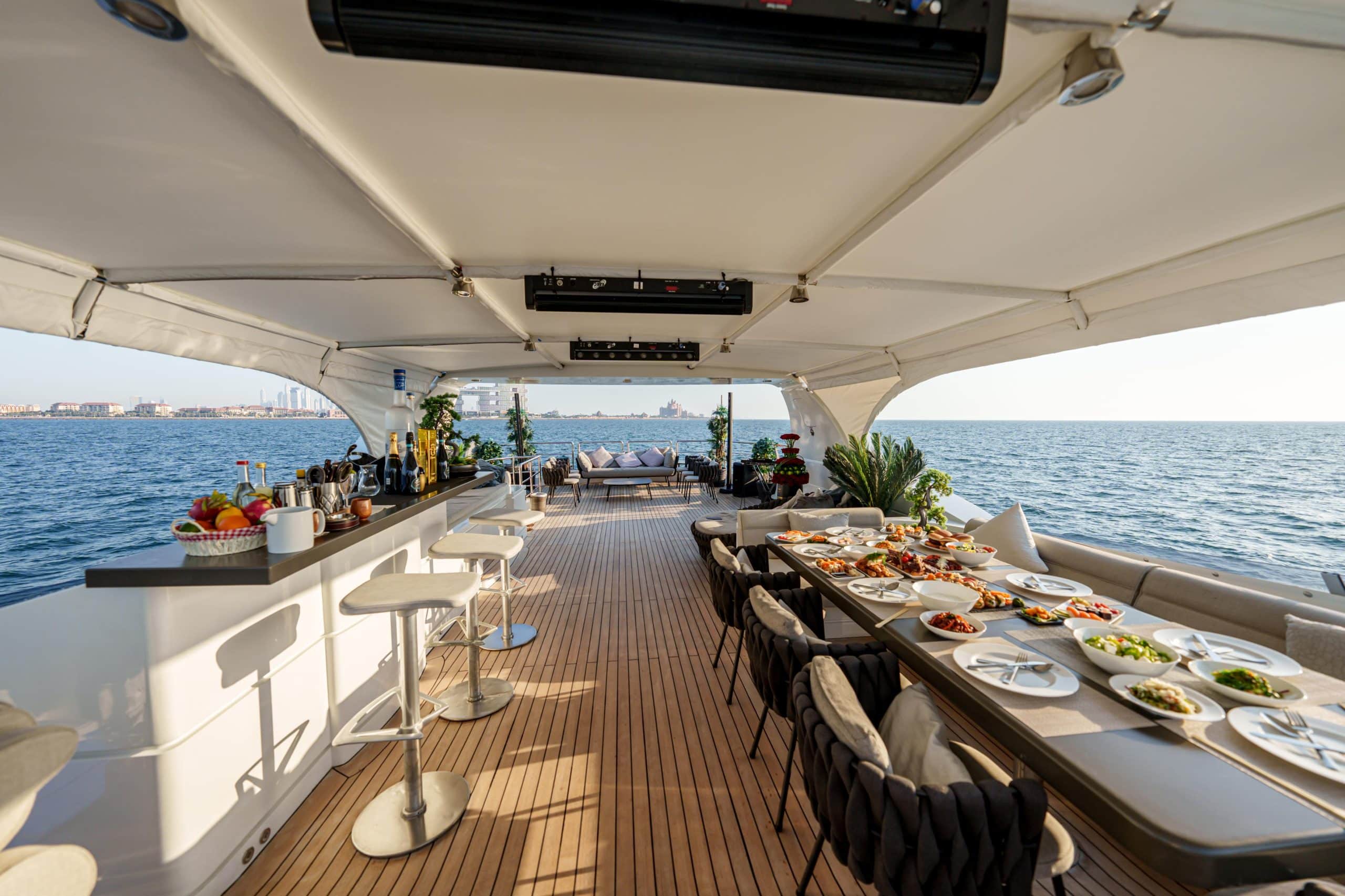 Luxury outdoor dining setup on Tatti 110 yacht deck in Dubai