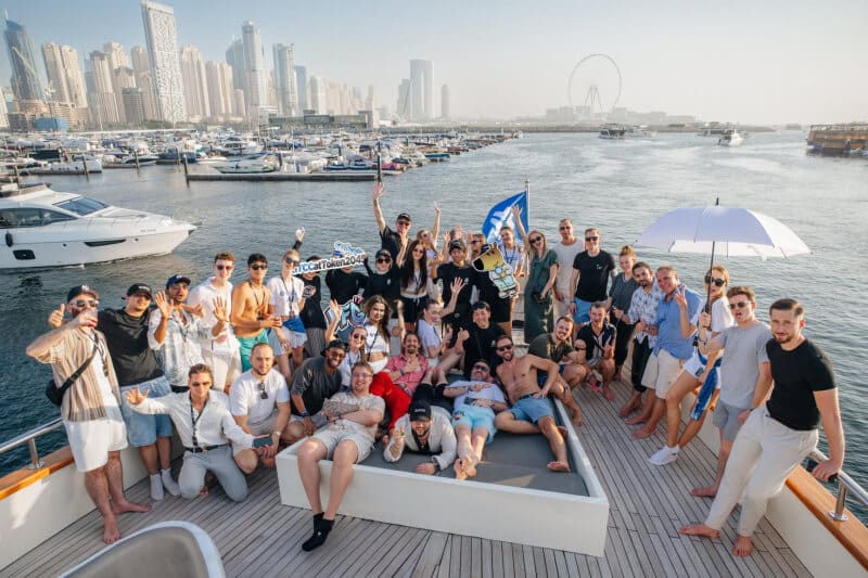 Corporate guests networking on a luxury yacht deck during a Dubai corporate yacht event