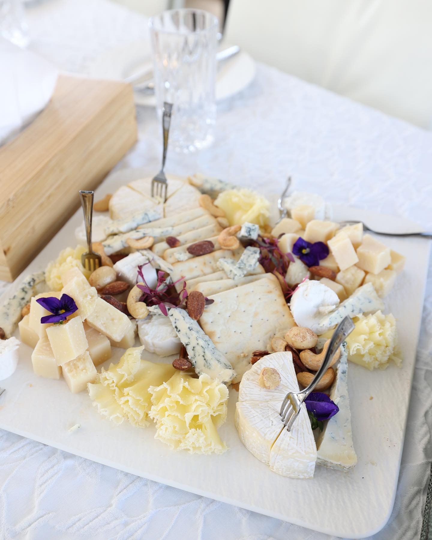 gourmet cheese platter with decorative presentation for yacht catering