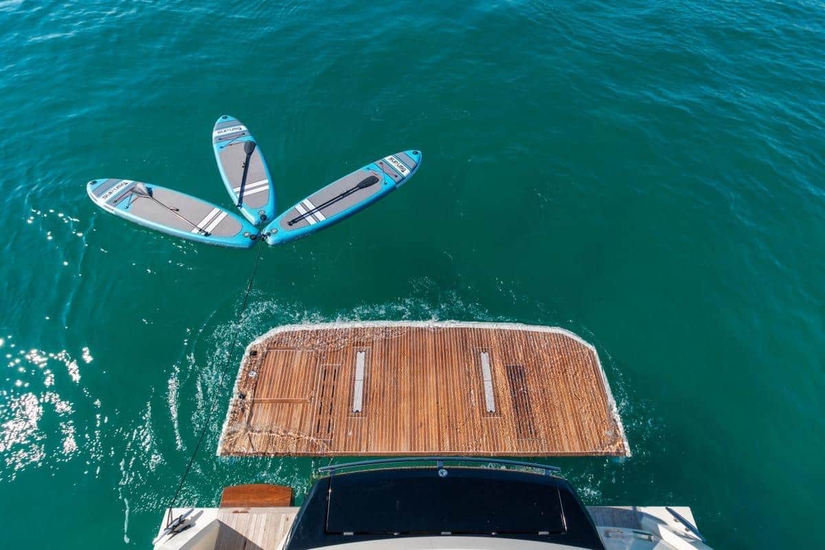 Monaco 60 yacht aerial top view in turquoise Dubai waters
