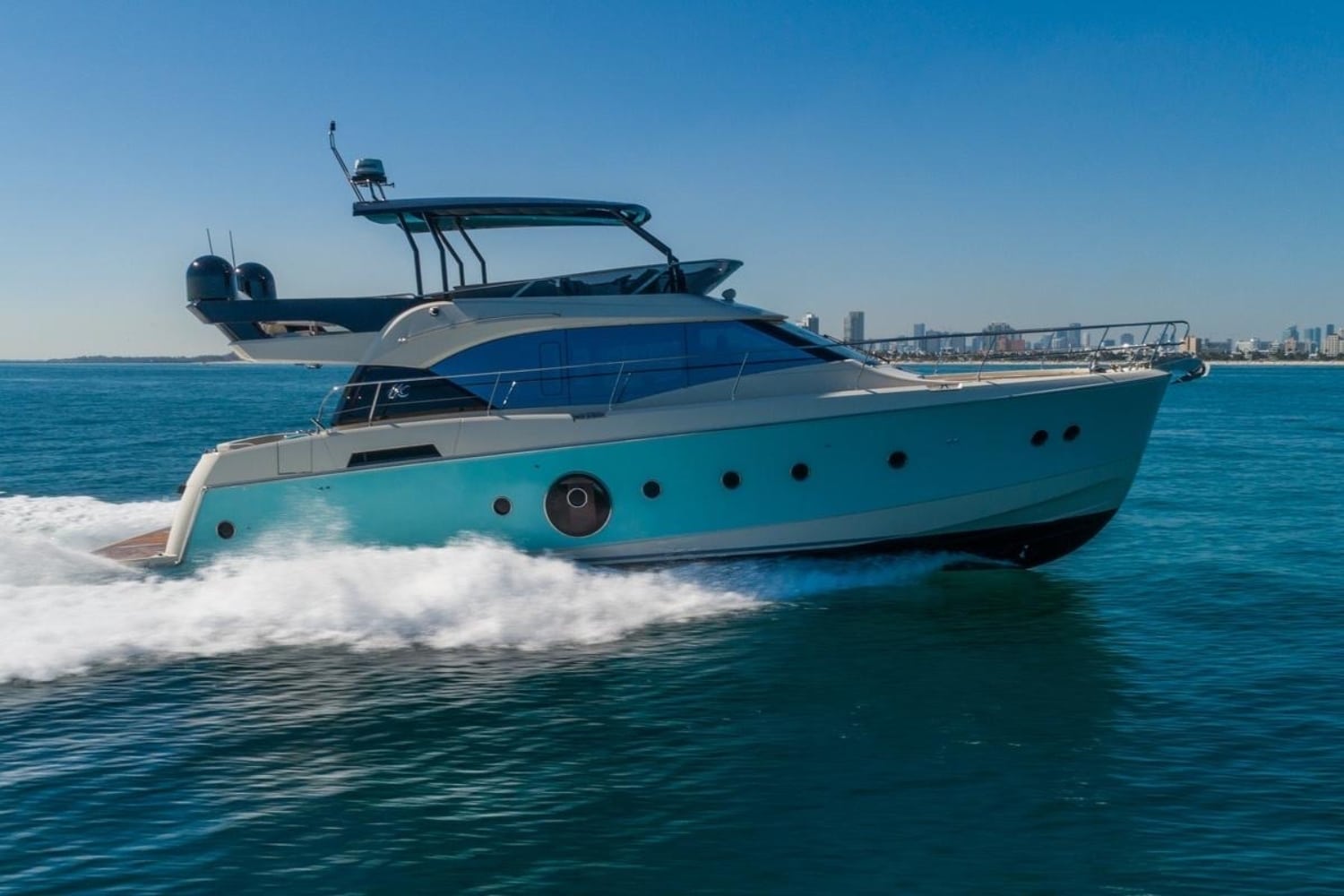 Monaco 60 yacht exterior side profile cruising in Dubai waters