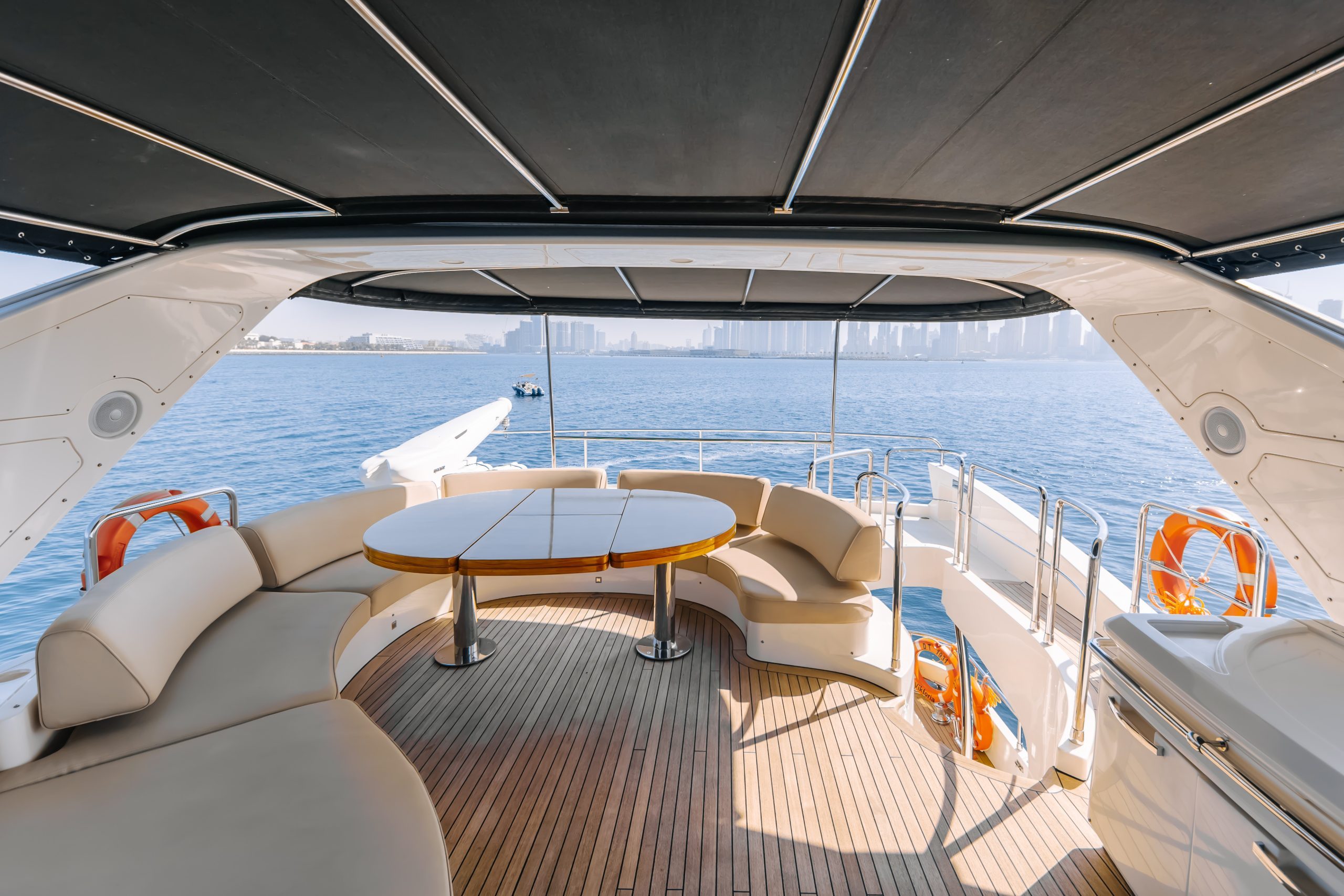 Outdoor dining area on Azimut 79 luxury yacht charter in Abu Dhabi marina