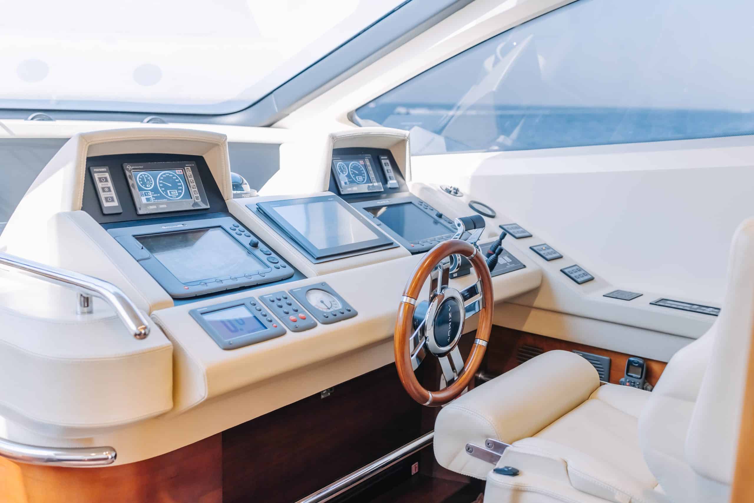 Navigation dashboard and steering wheel on Azimut 79 luxury yacht