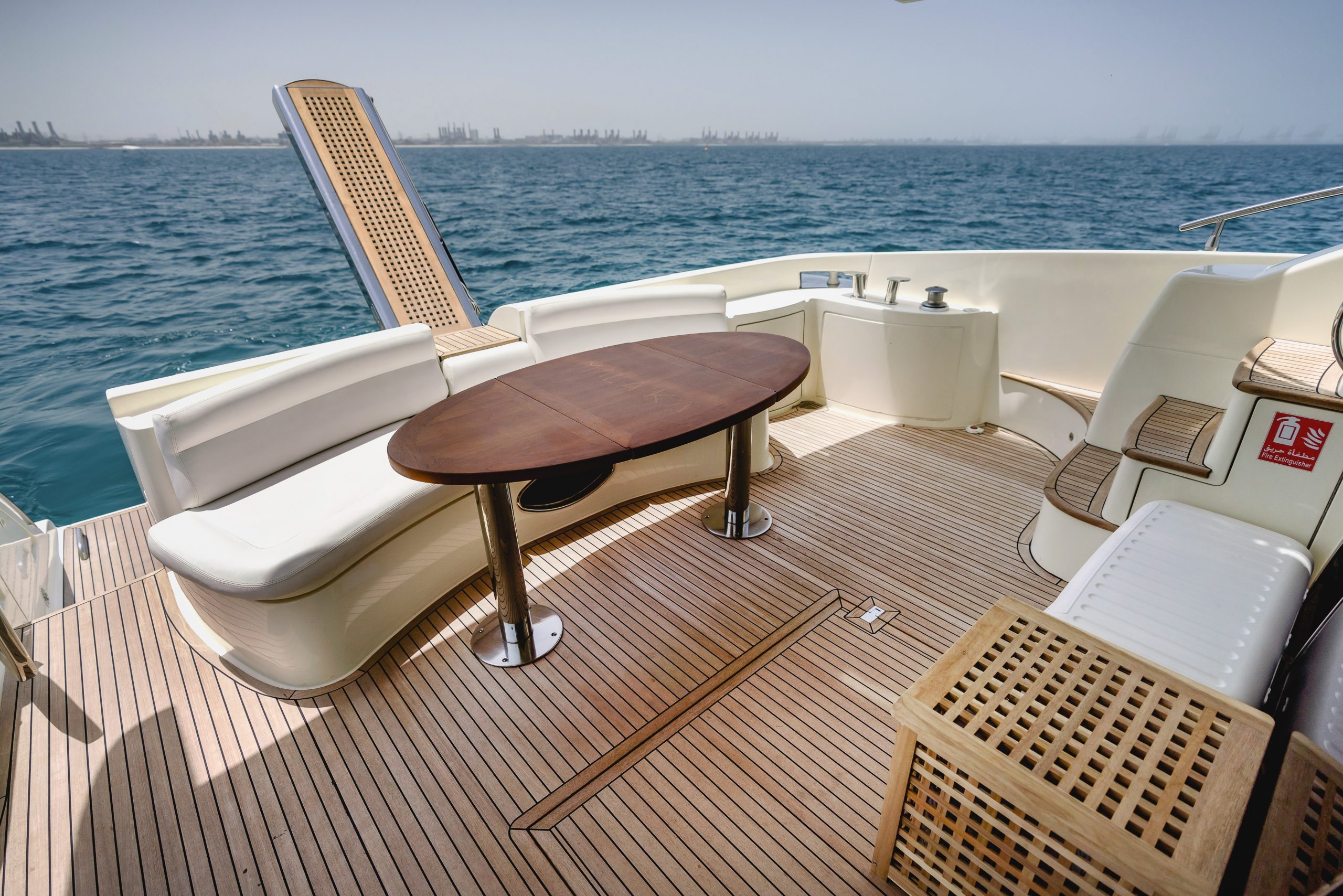 Bow seating table area on Azimut 62 luxury yacht charter in Abu Dhabi