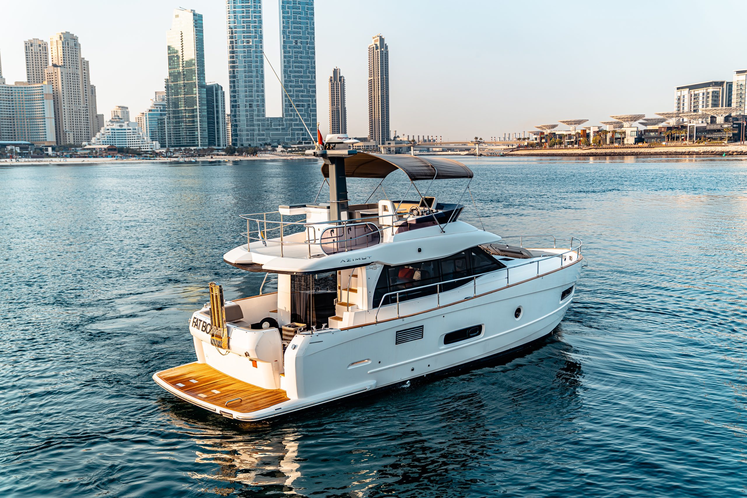 Azimut 50 Migueria yacht cruising with city skyline