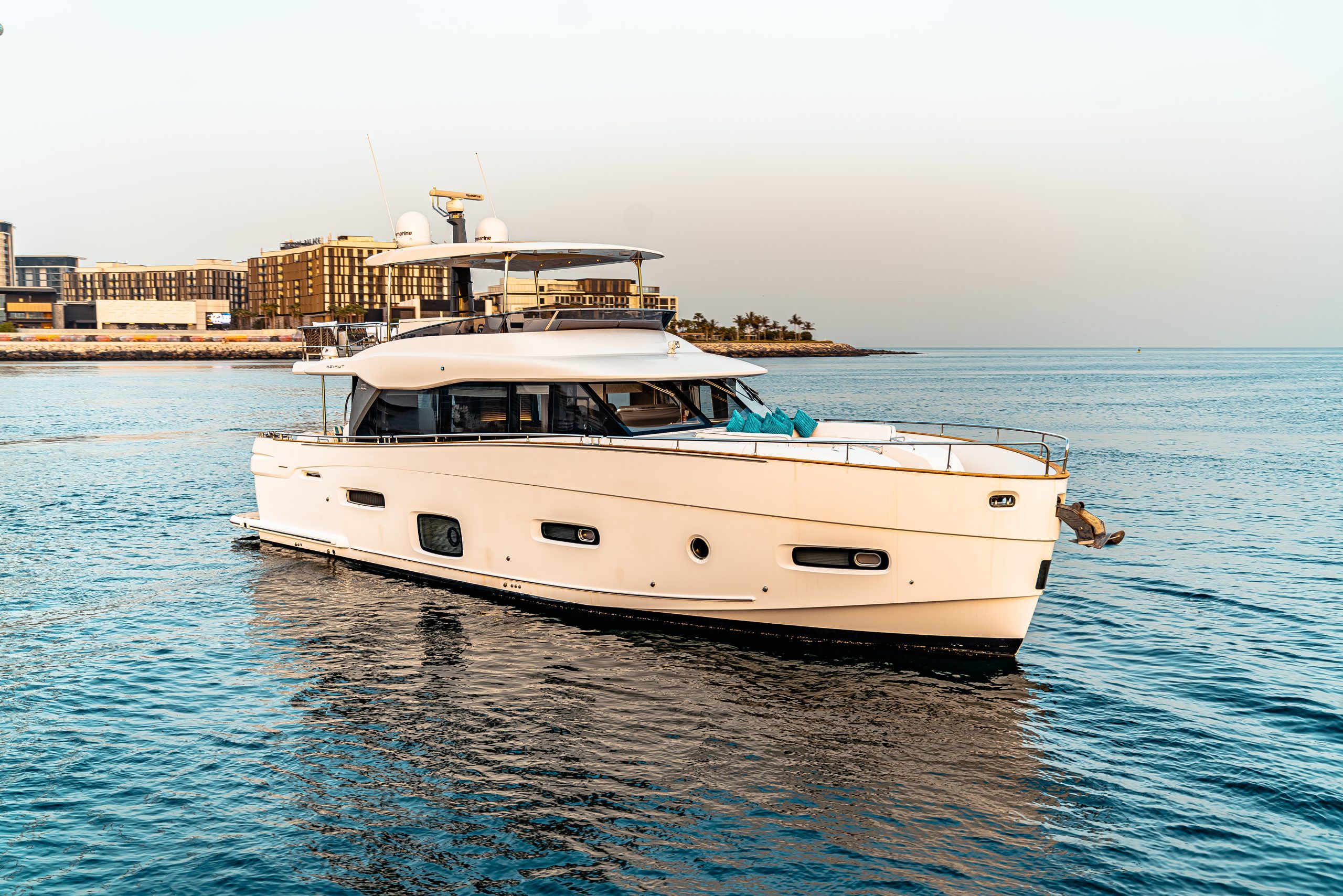 Azimut 70 Migueria luxury yacht cruising on water
