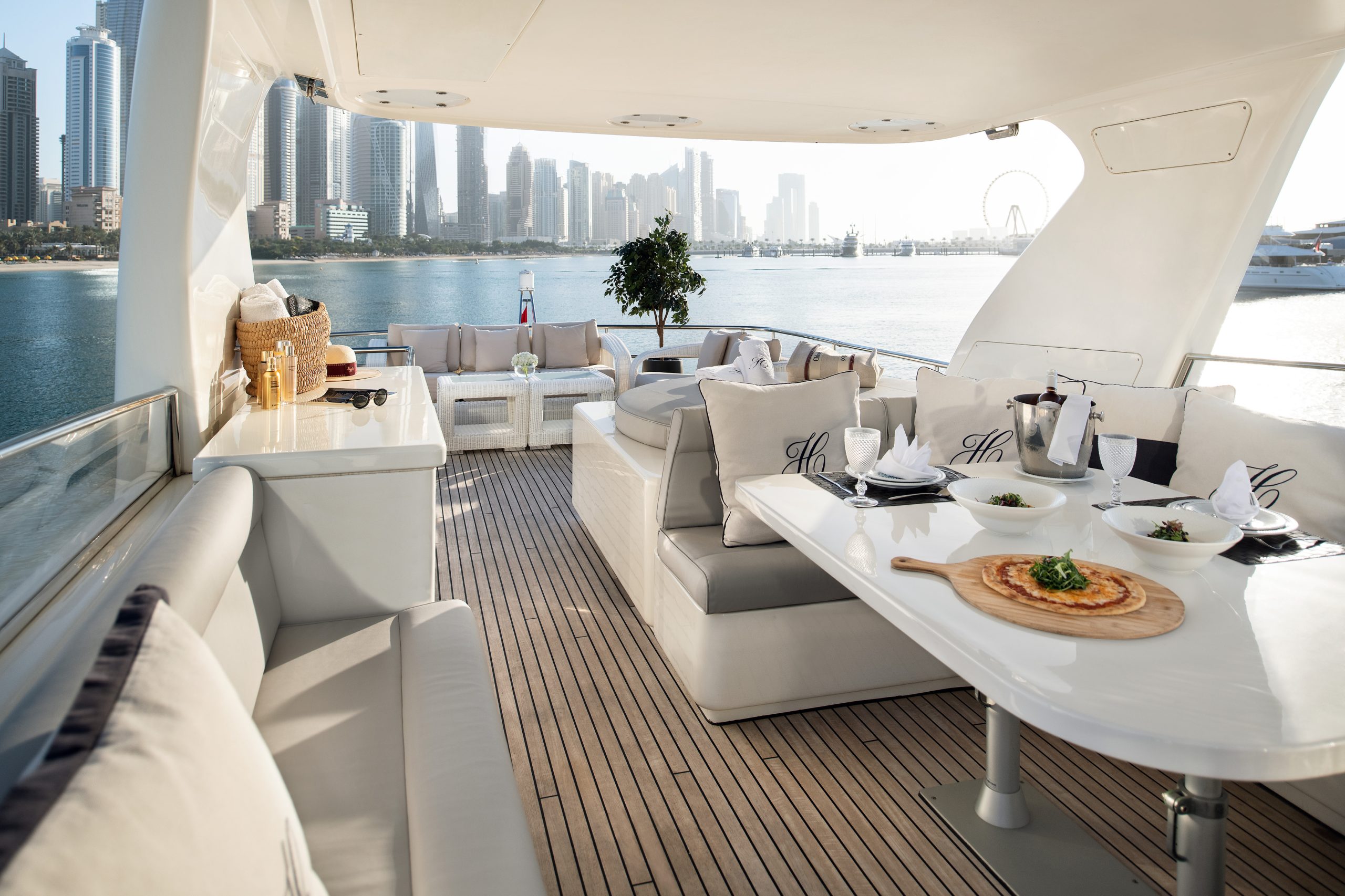 Luxury yacht spacious deck seating area overlooking Dubai Marina