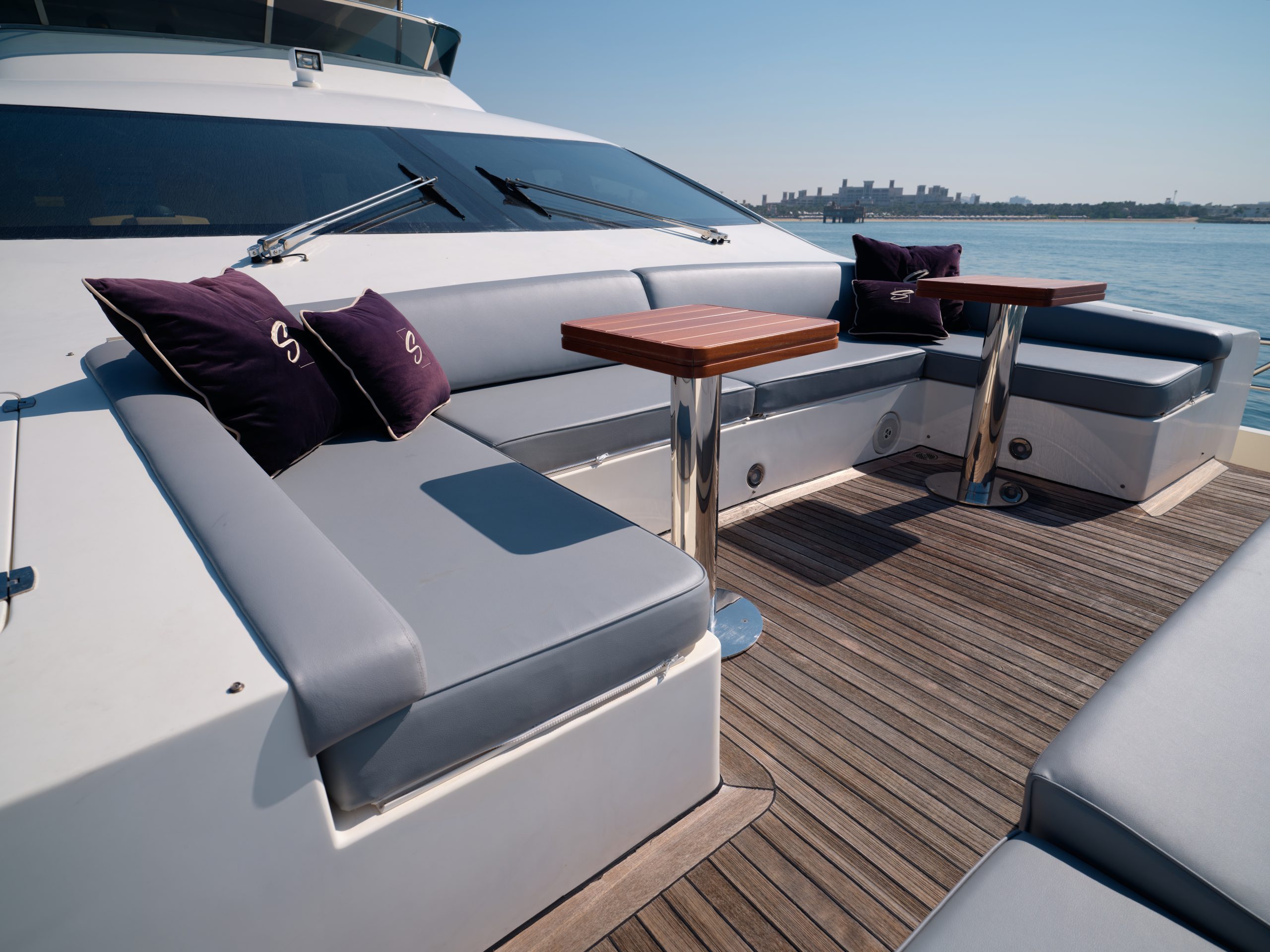 Comfortable sunbathing area with cushions on Azimut 88 yacht