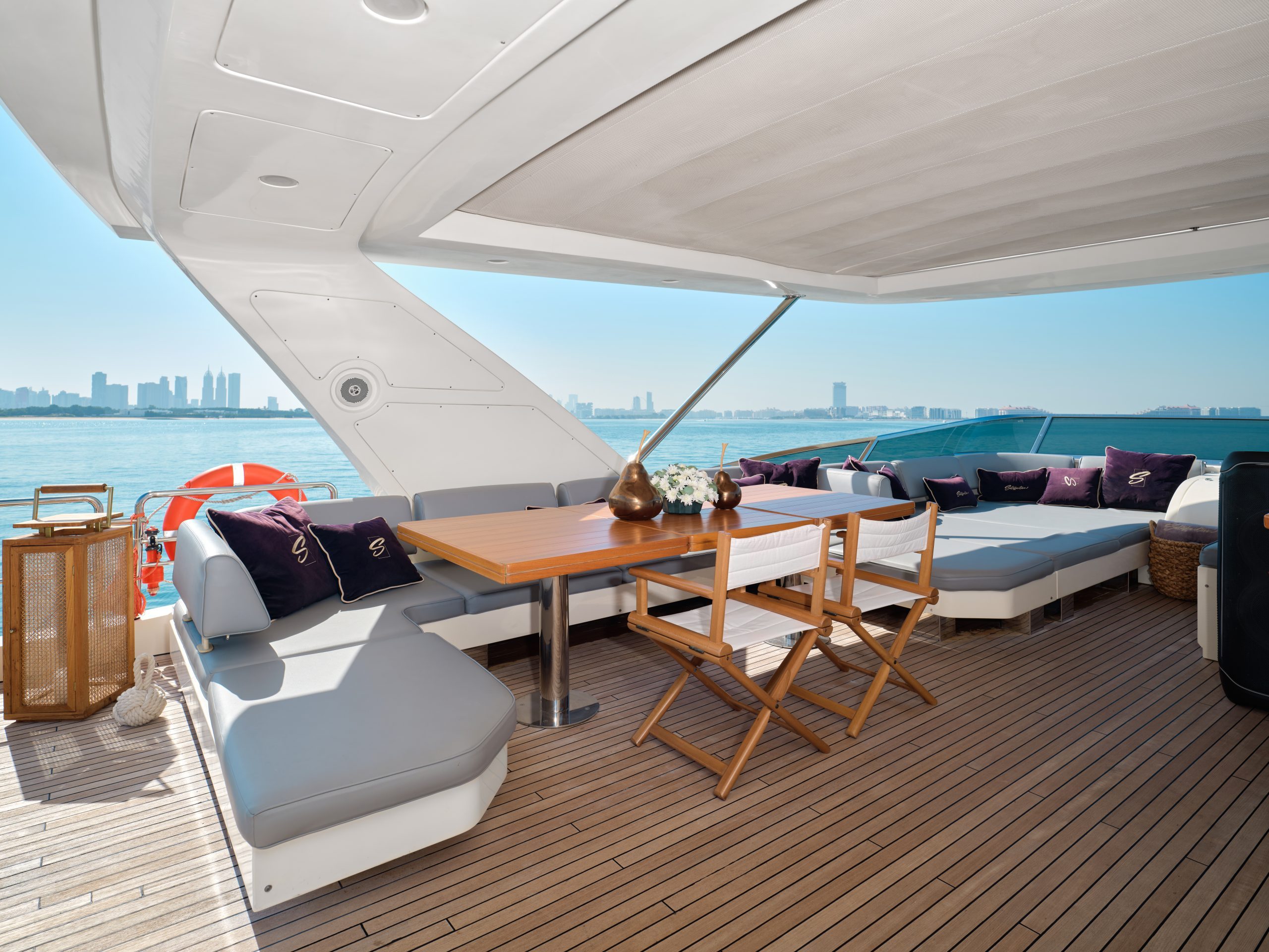 Shaded lounge and dining space on Azimut 88 yacht
