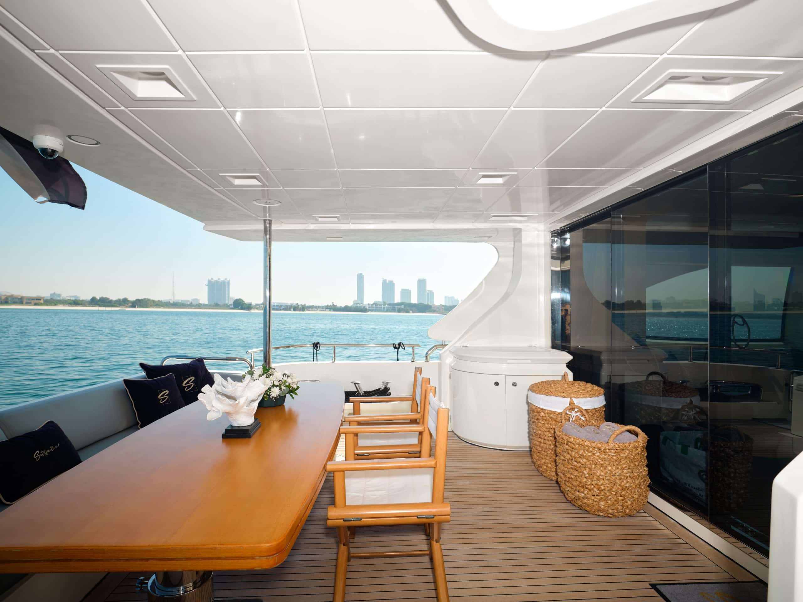 Outdoor aft deck dining setup on Azimut 88 yacht