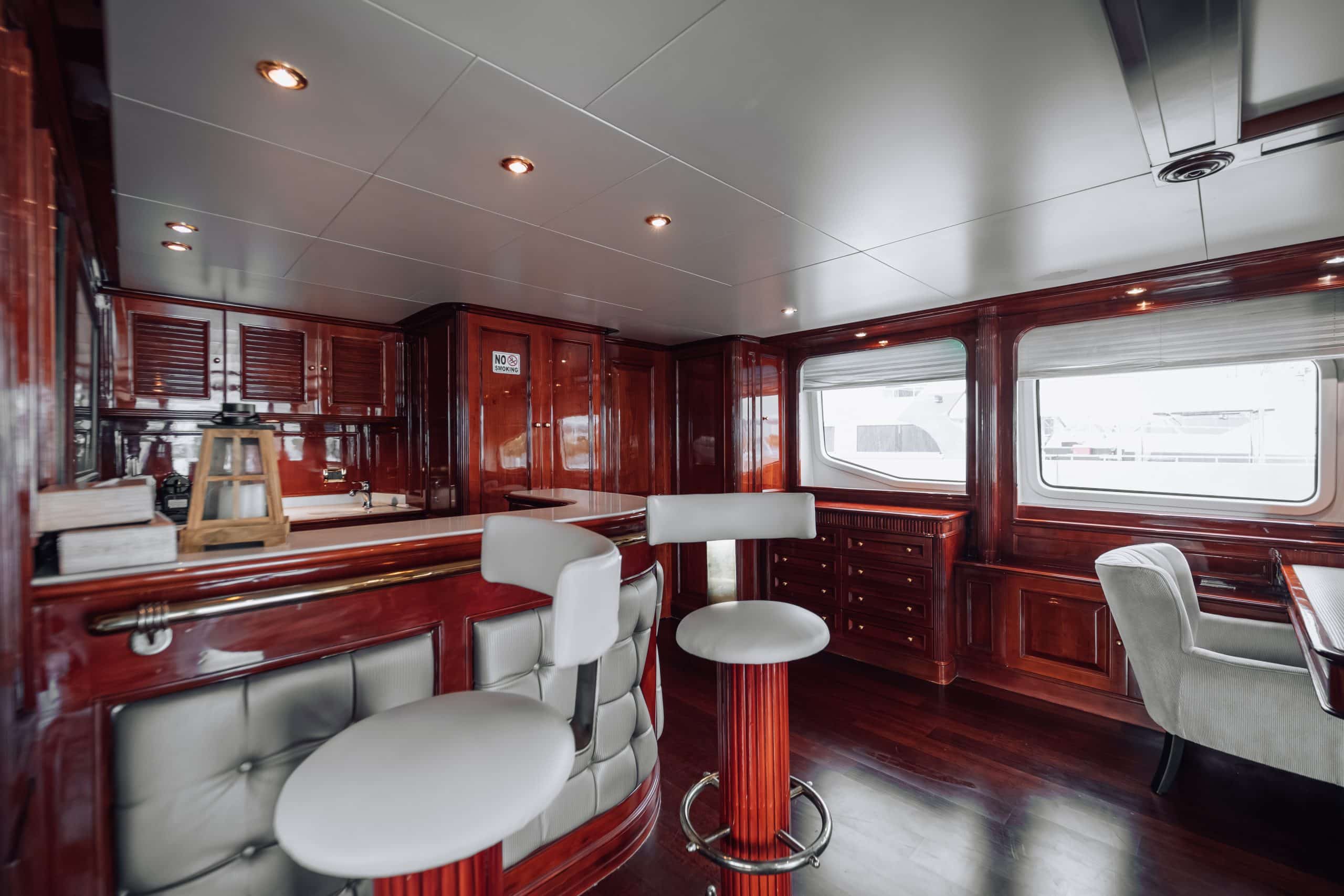 Upper deck lounge area on Royal Mirage yacht with leather seating