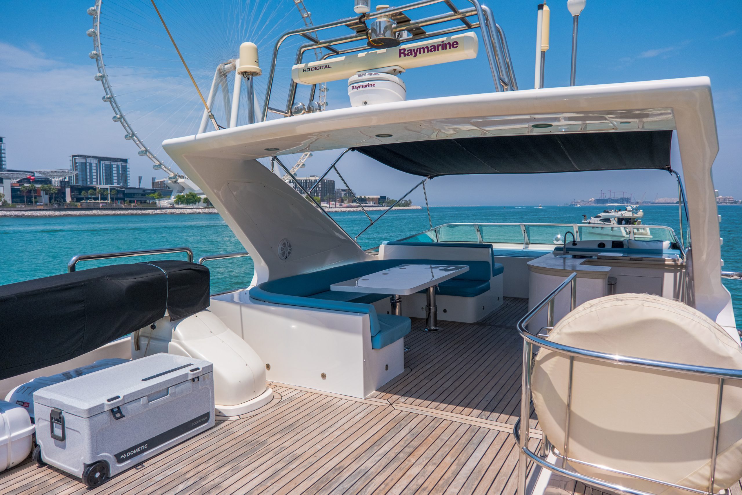Cabo 77 yacht flybridge with luxury seating and open-air entertainment space