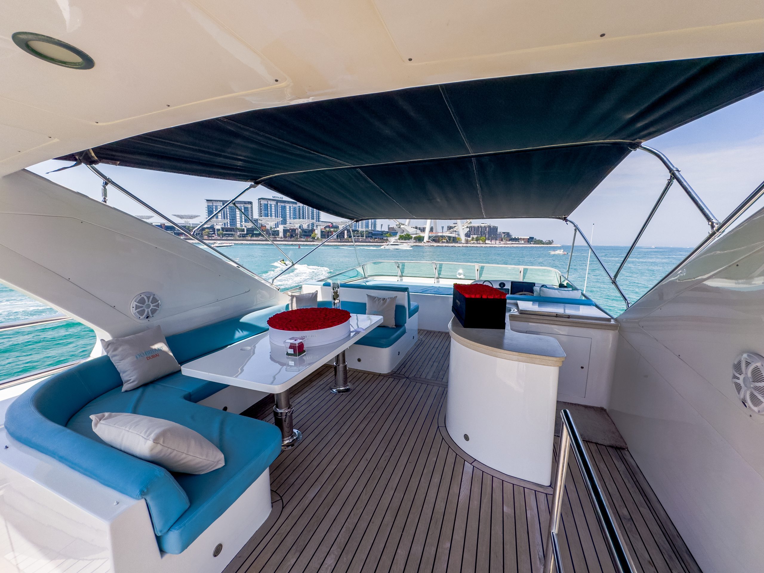 Cabo 77 luxury yacht outdoor seating area with modern sofa setup in Dubai
