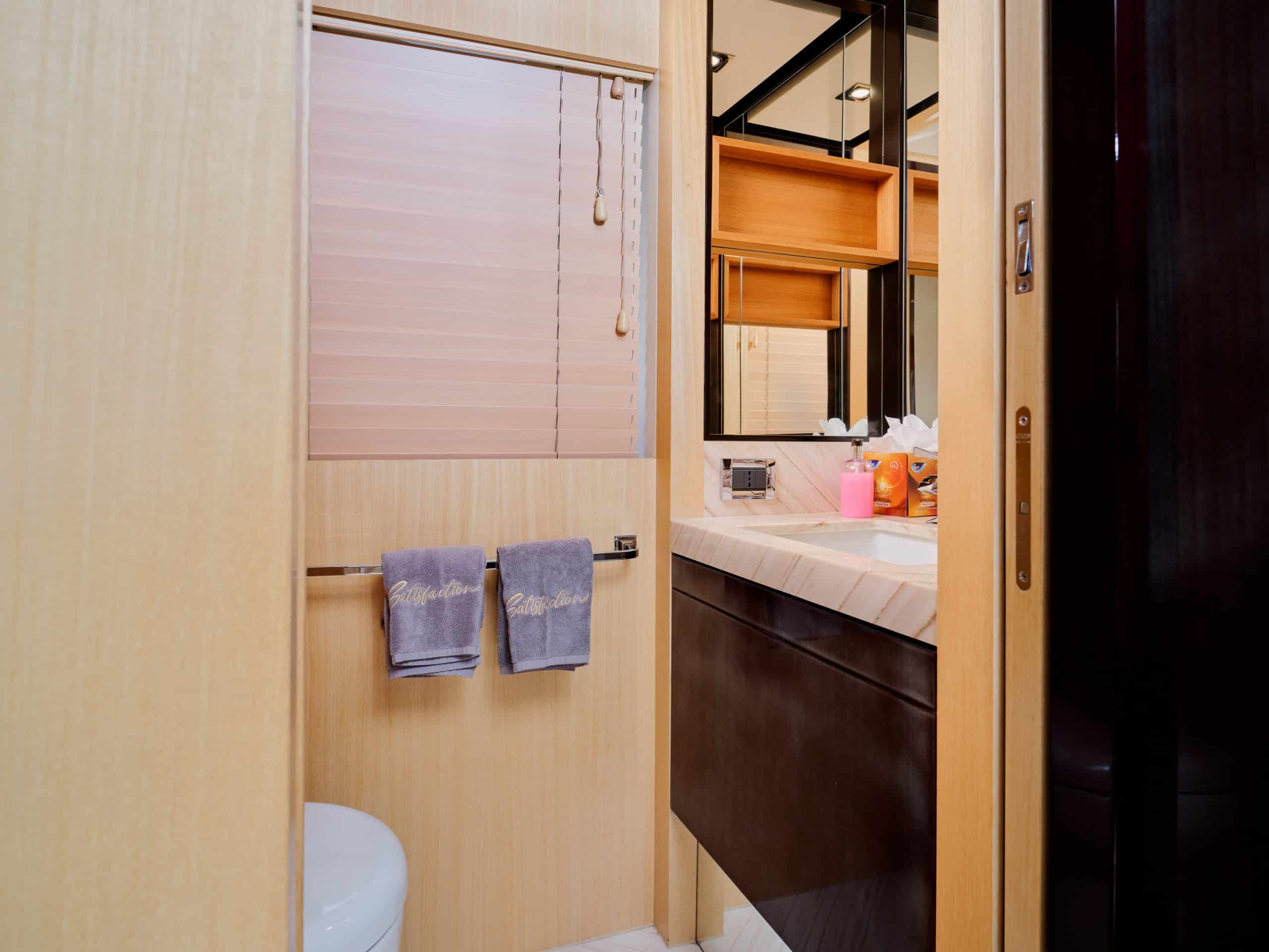Compact yacht bathroom facilities inside Azimut 88