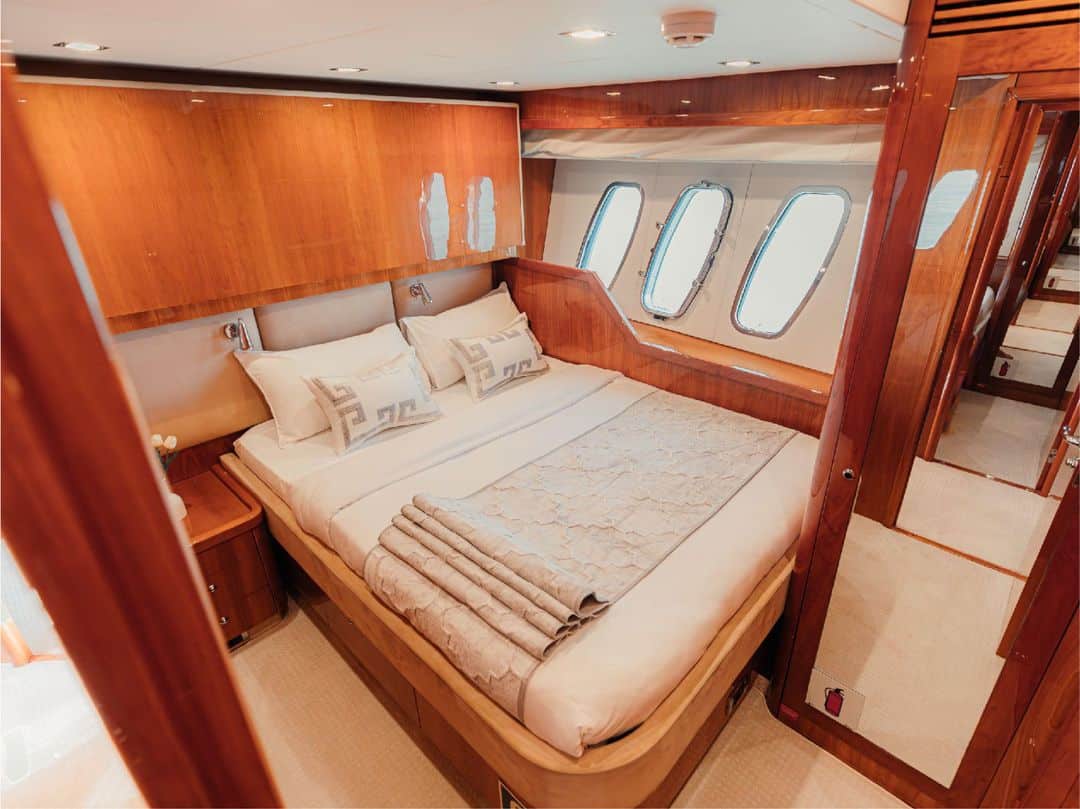 Twin guest cabin on Notorious yacht with large windows