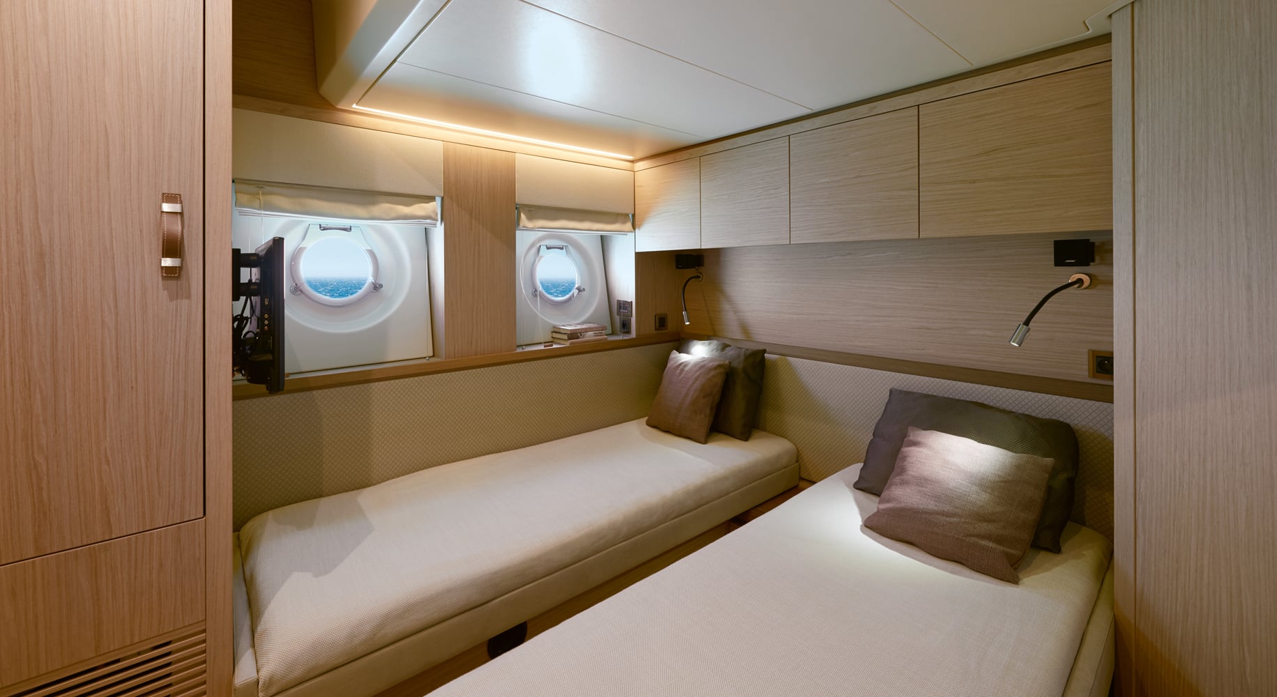 Monaco 60 yacht guest cabin with large bed and ambient lighting