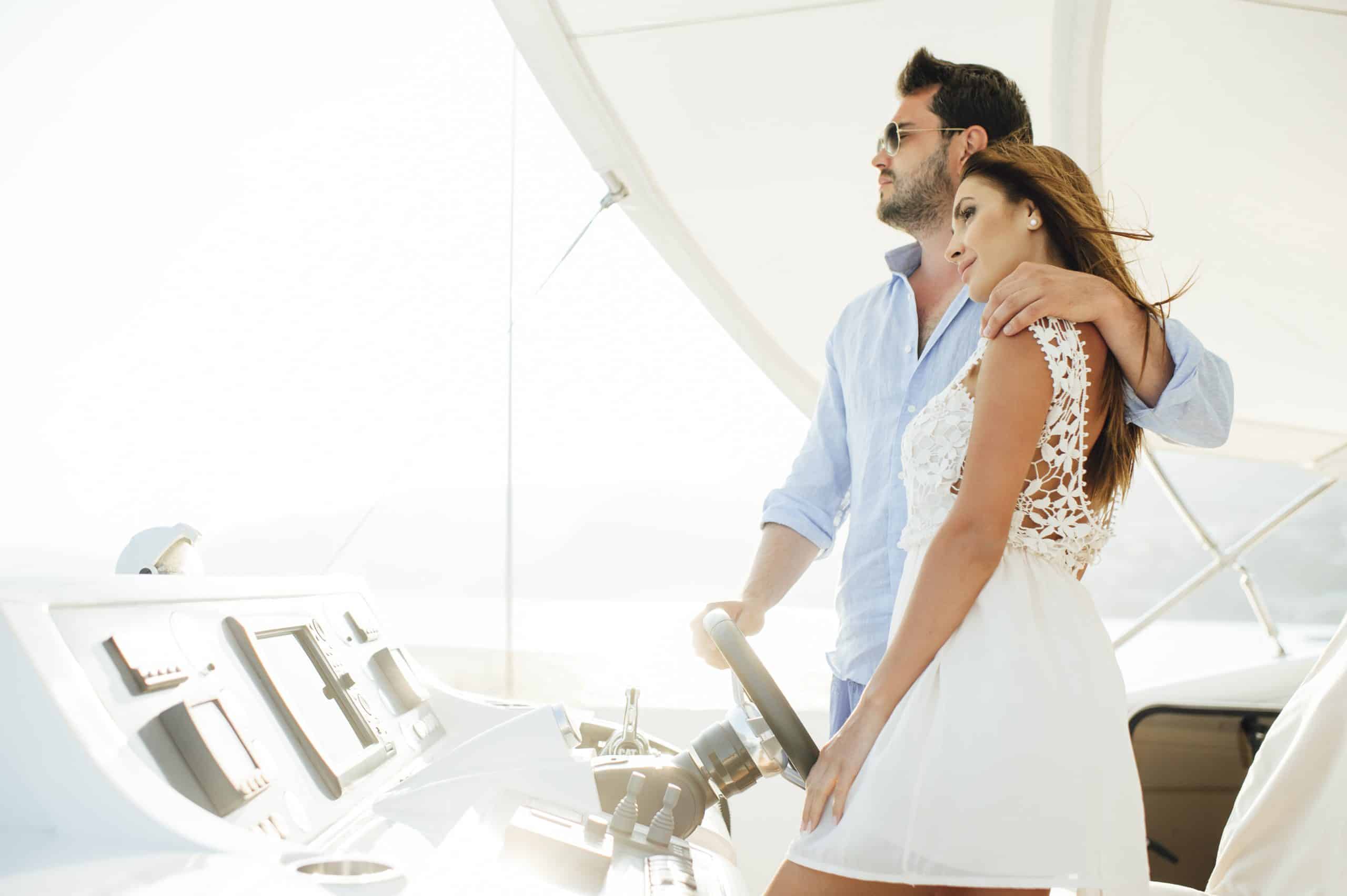 wedding couple enjoying romantic moment on luxury yacht deck