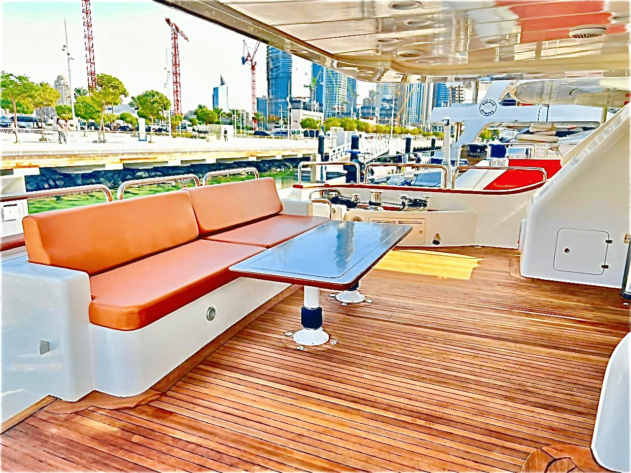 Benetti 120 outdoor lounge seating area with modern furniture and wooden deck
