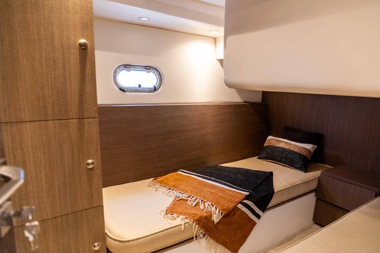 Elan 44 guest cabin with bed and wooden interior design