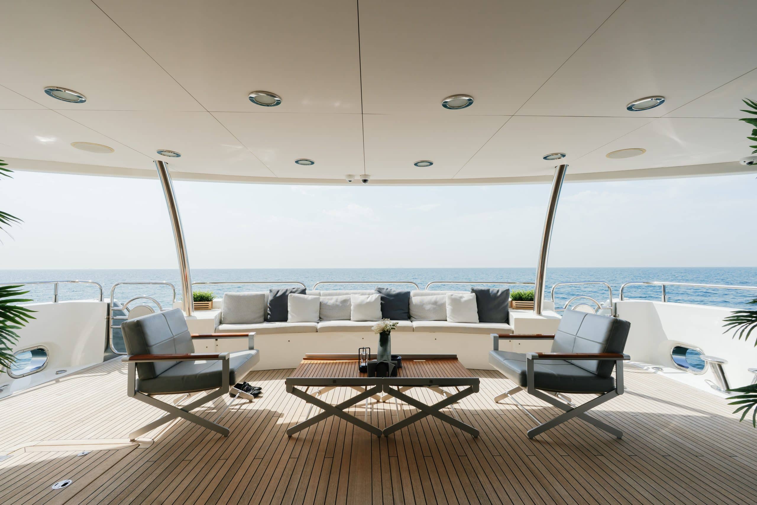 Aurora 130 yacht outdoor deck lounge with sea views and modern seating