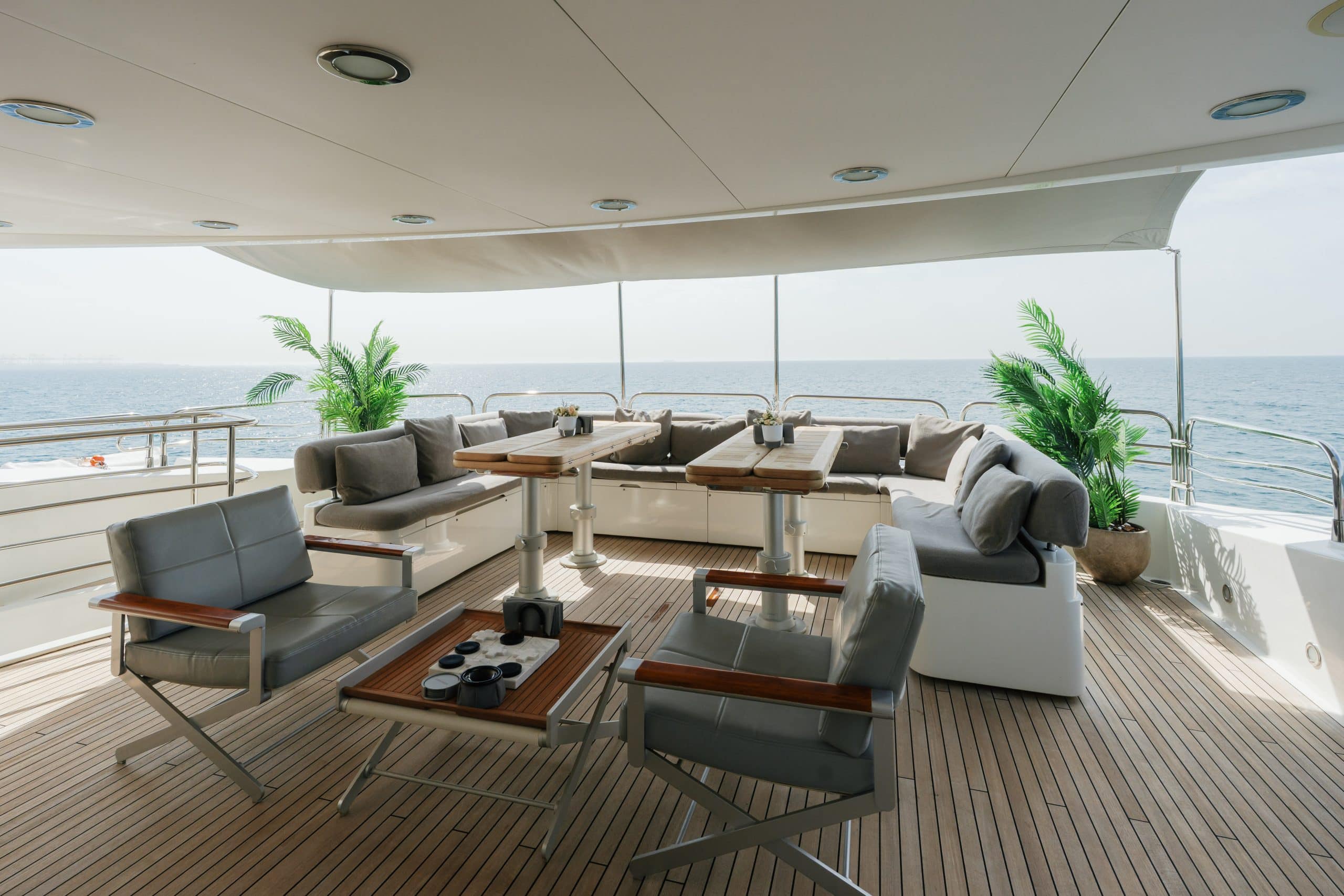 Aurora 130 yacht interior lounge with wraparound seating and ocean views