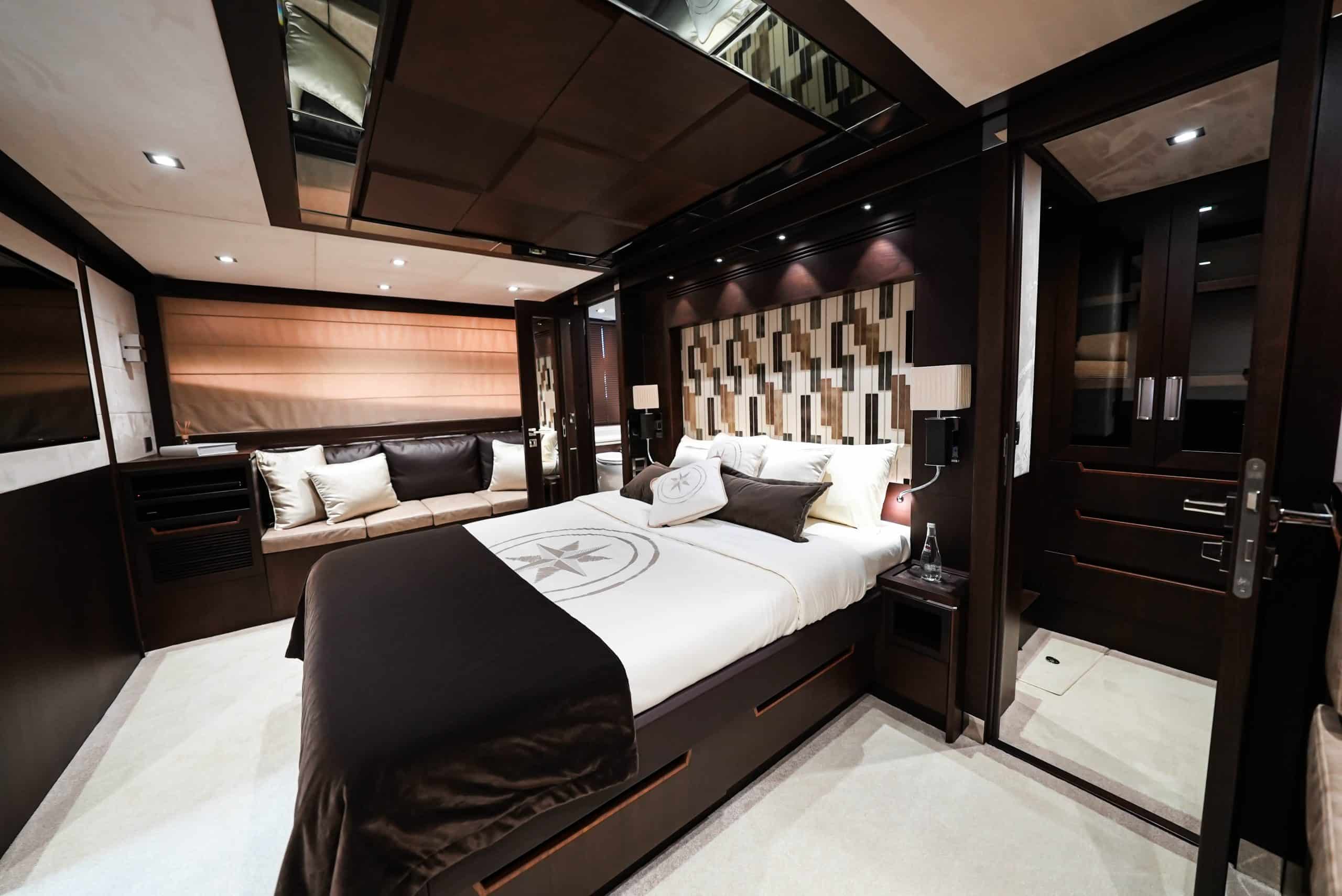 Galeon 780 F1 VIP cabin with luxury bed, padded headboard, and glossy wood finishes