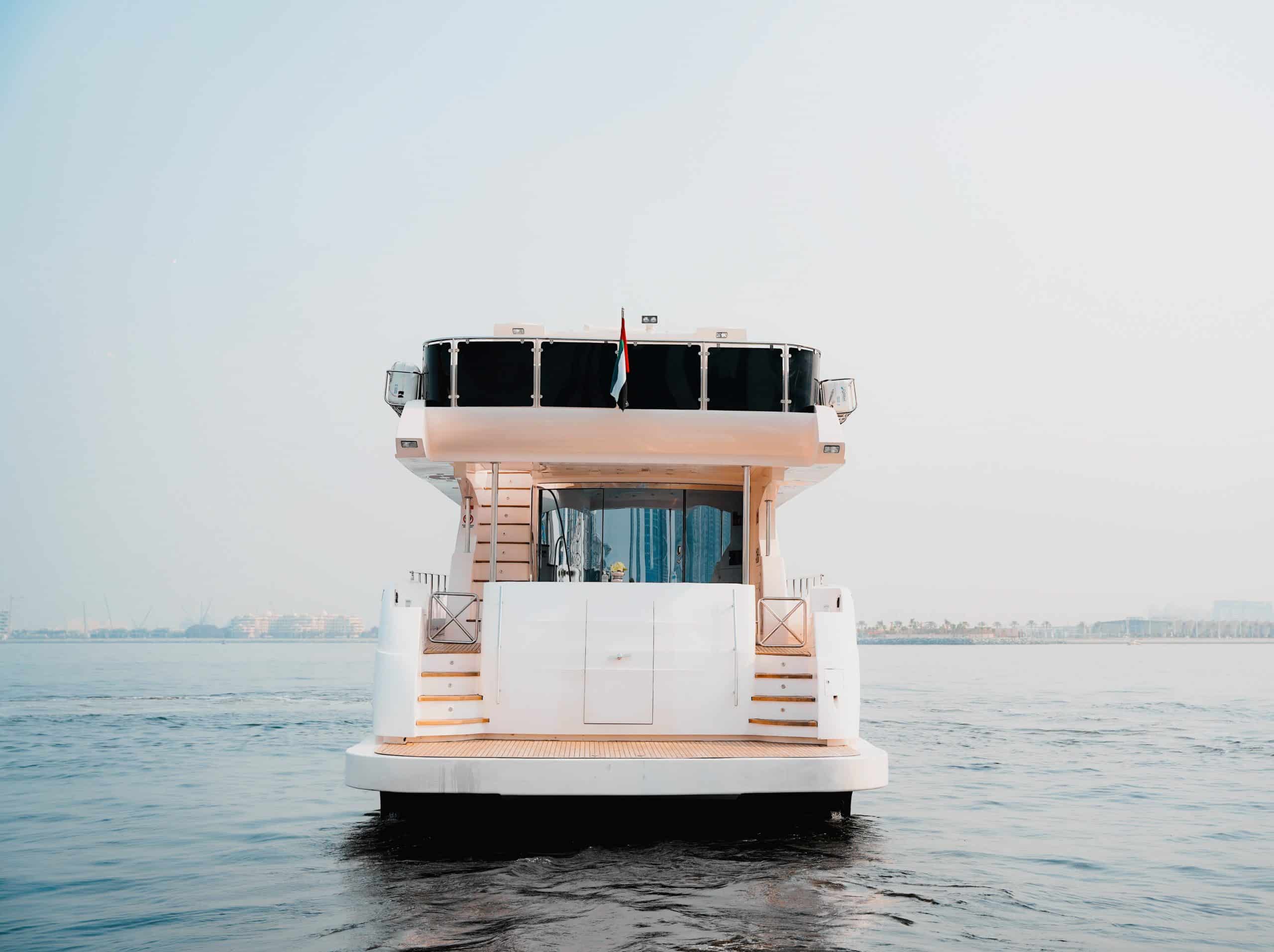 Front view of luxury yacht cruising on open sea for private yacht charter experience
