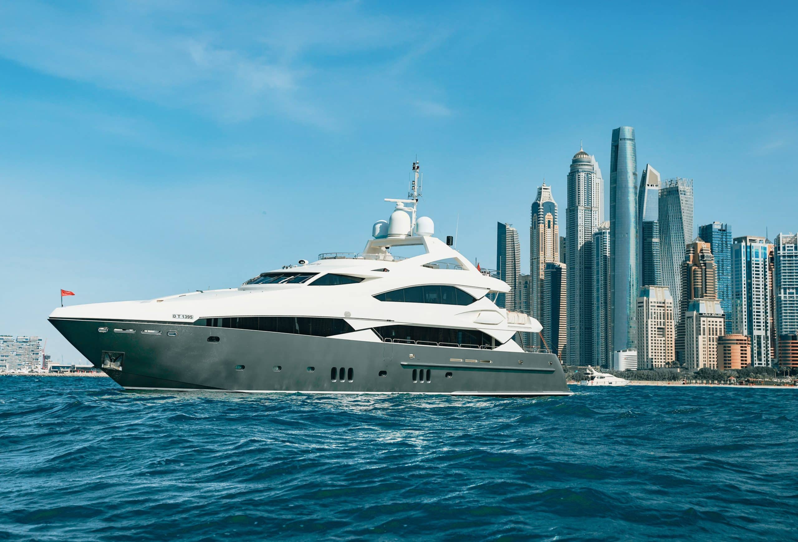 Aurora 130 yacht exterior profile near Dubai skyline