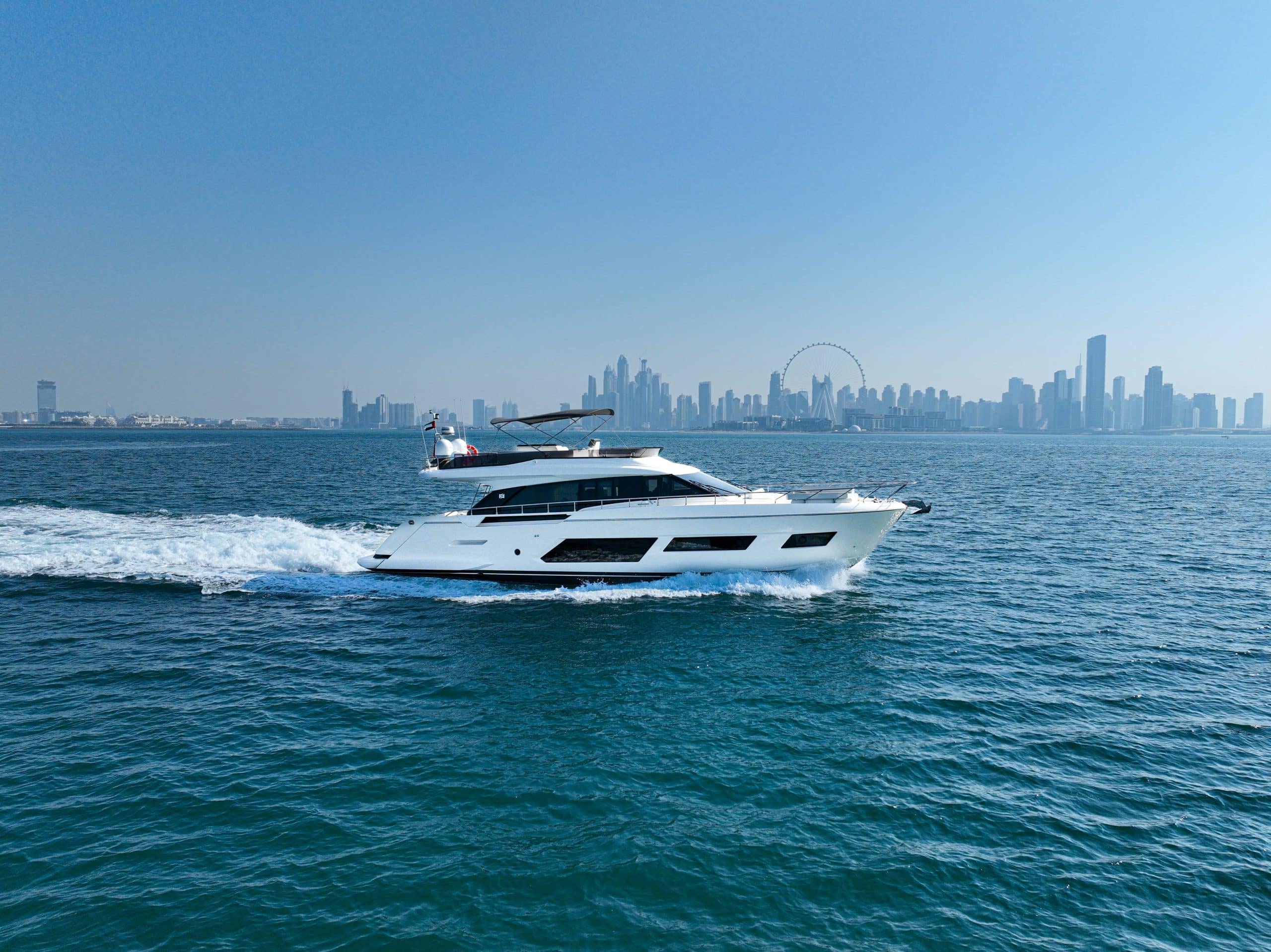 Ferretti 670 yacht cruising in blue Dubai waters