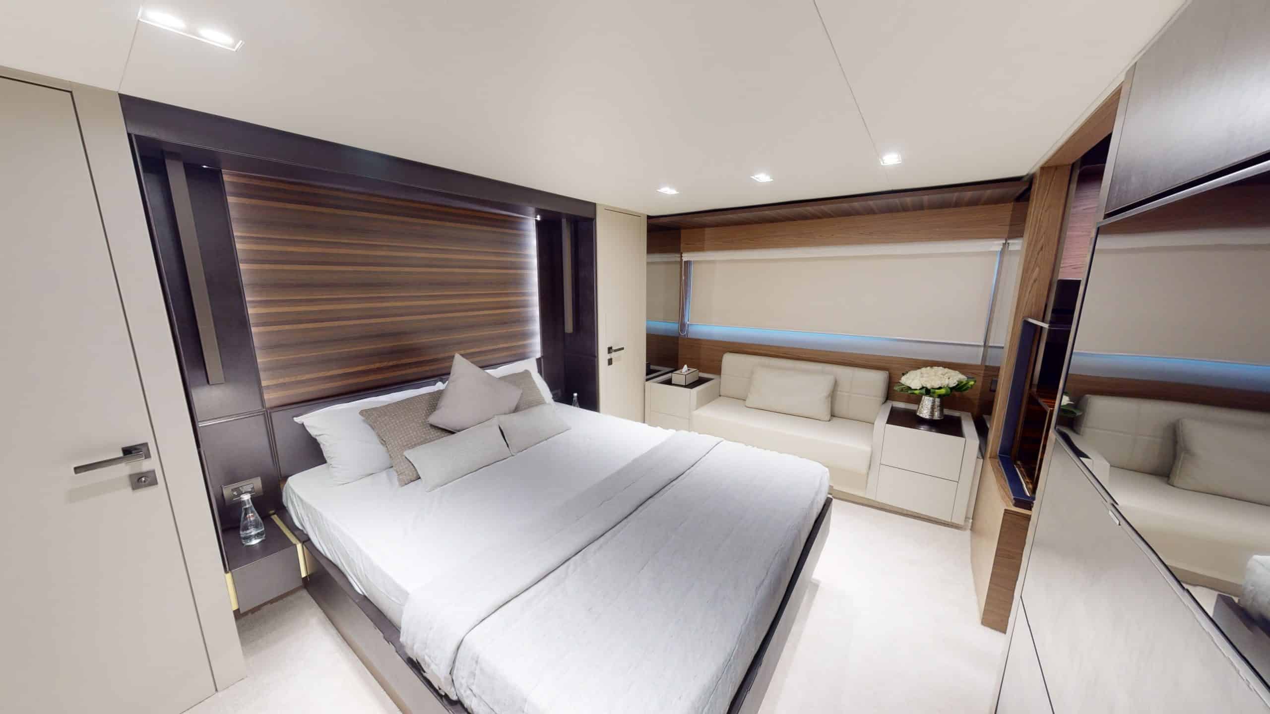 Ferretti 670 yacht master cabin with double bed and modern lighting