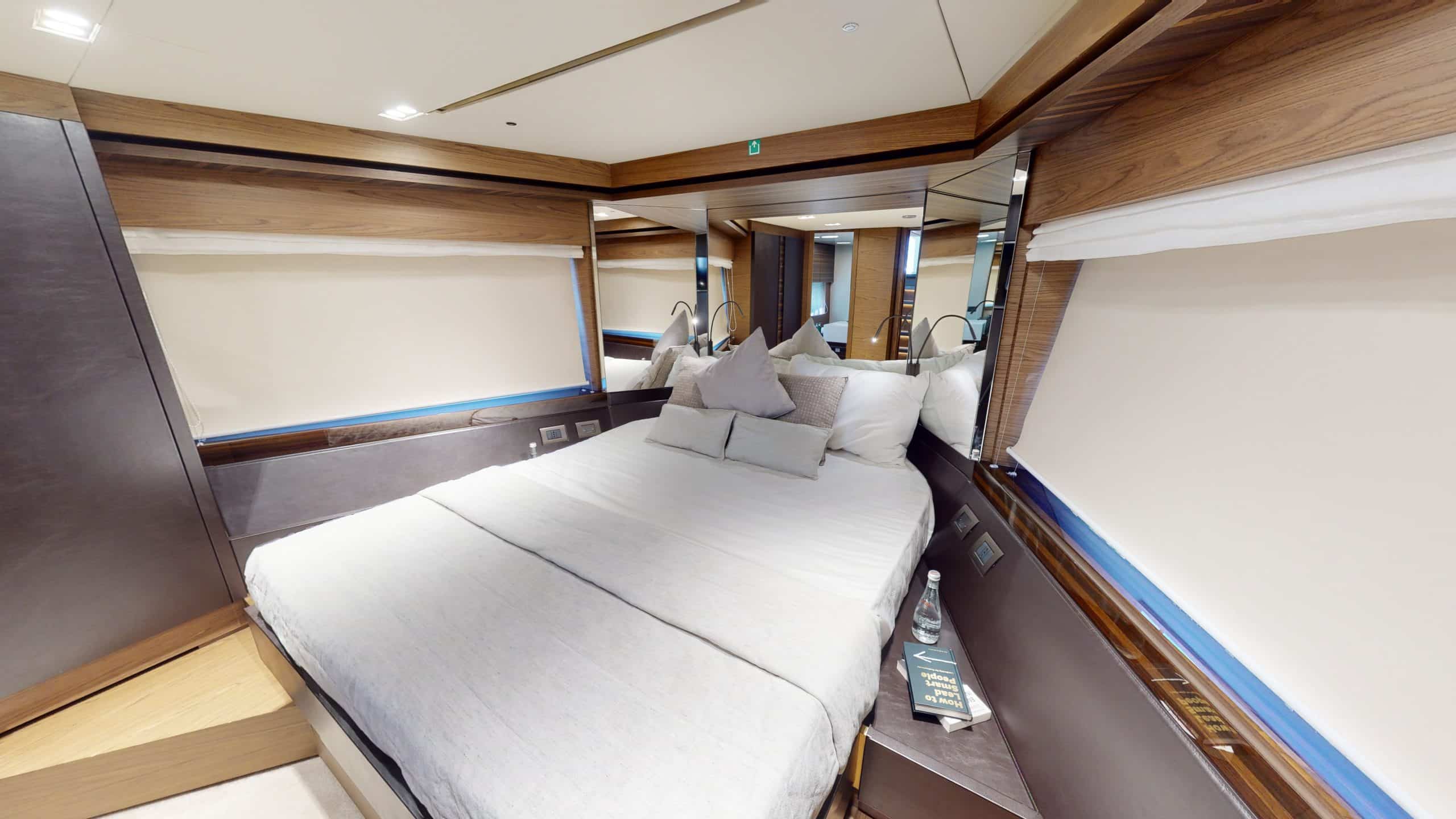 Ferretti 670 yacht twin guest cabin with side storage and natural light