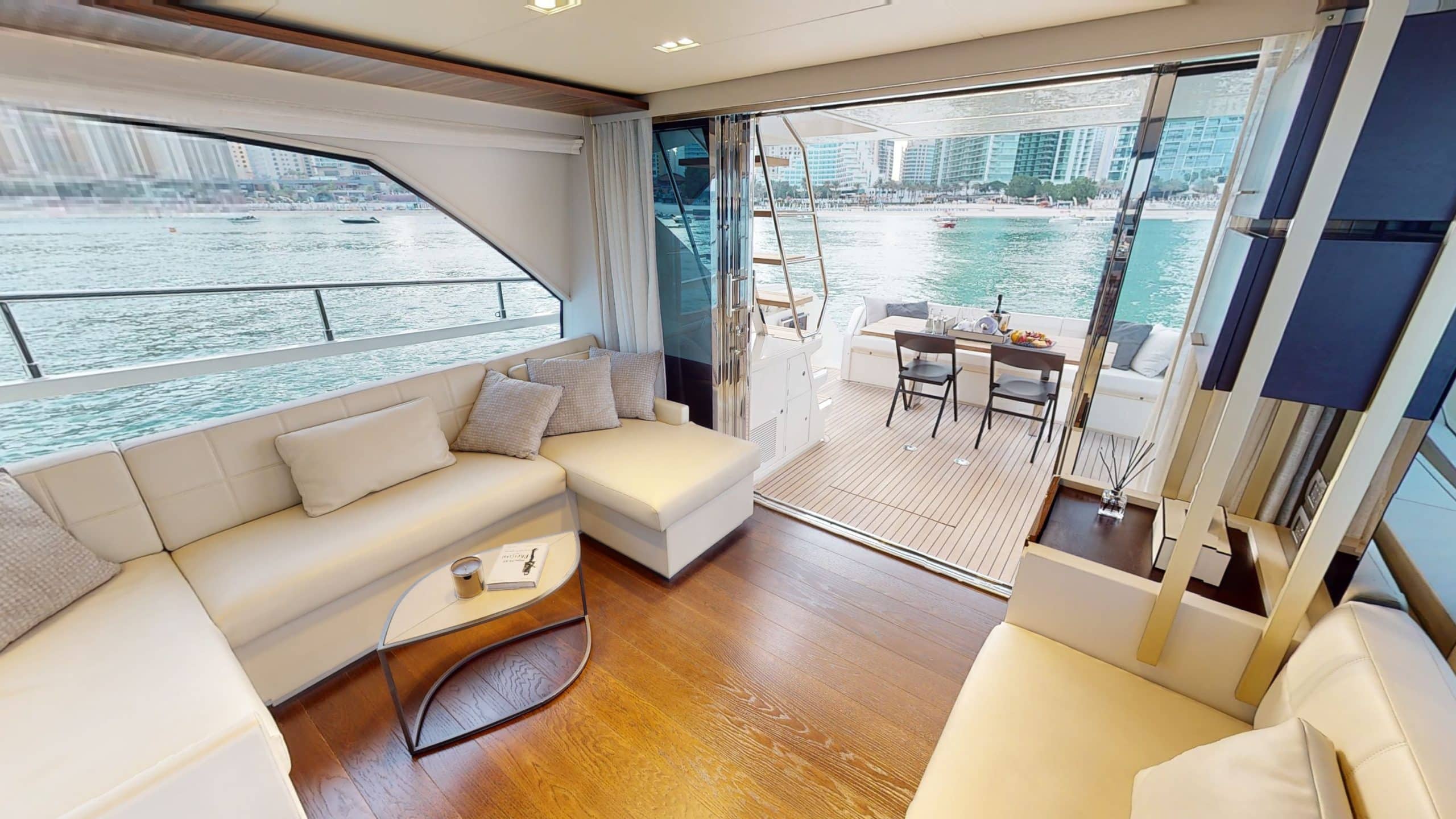 Interior lounge area with sea views inside Ferretti 670 yacht