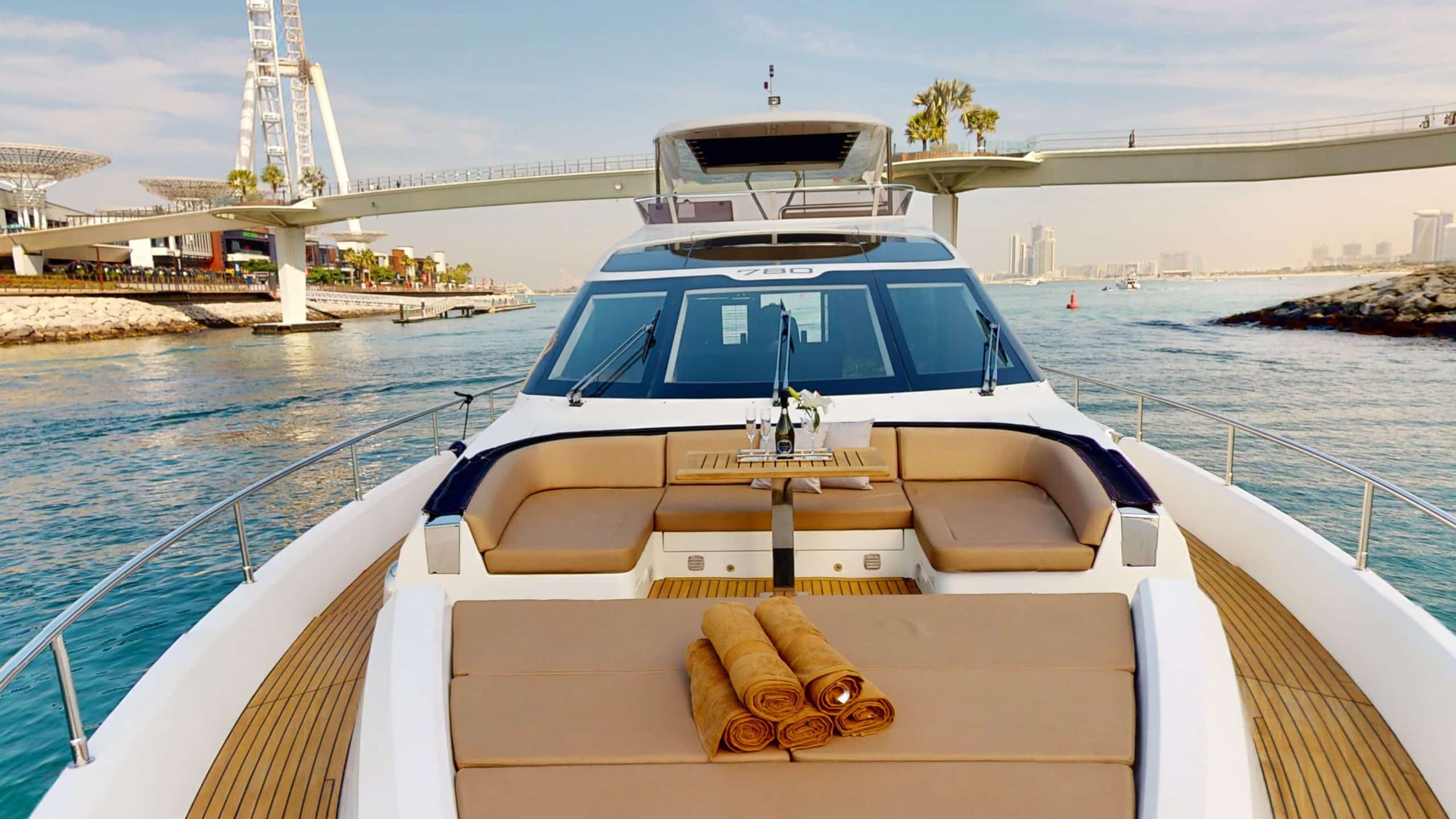 Galeon 780 F1 yacht front lounge seating area with luxury sun pads