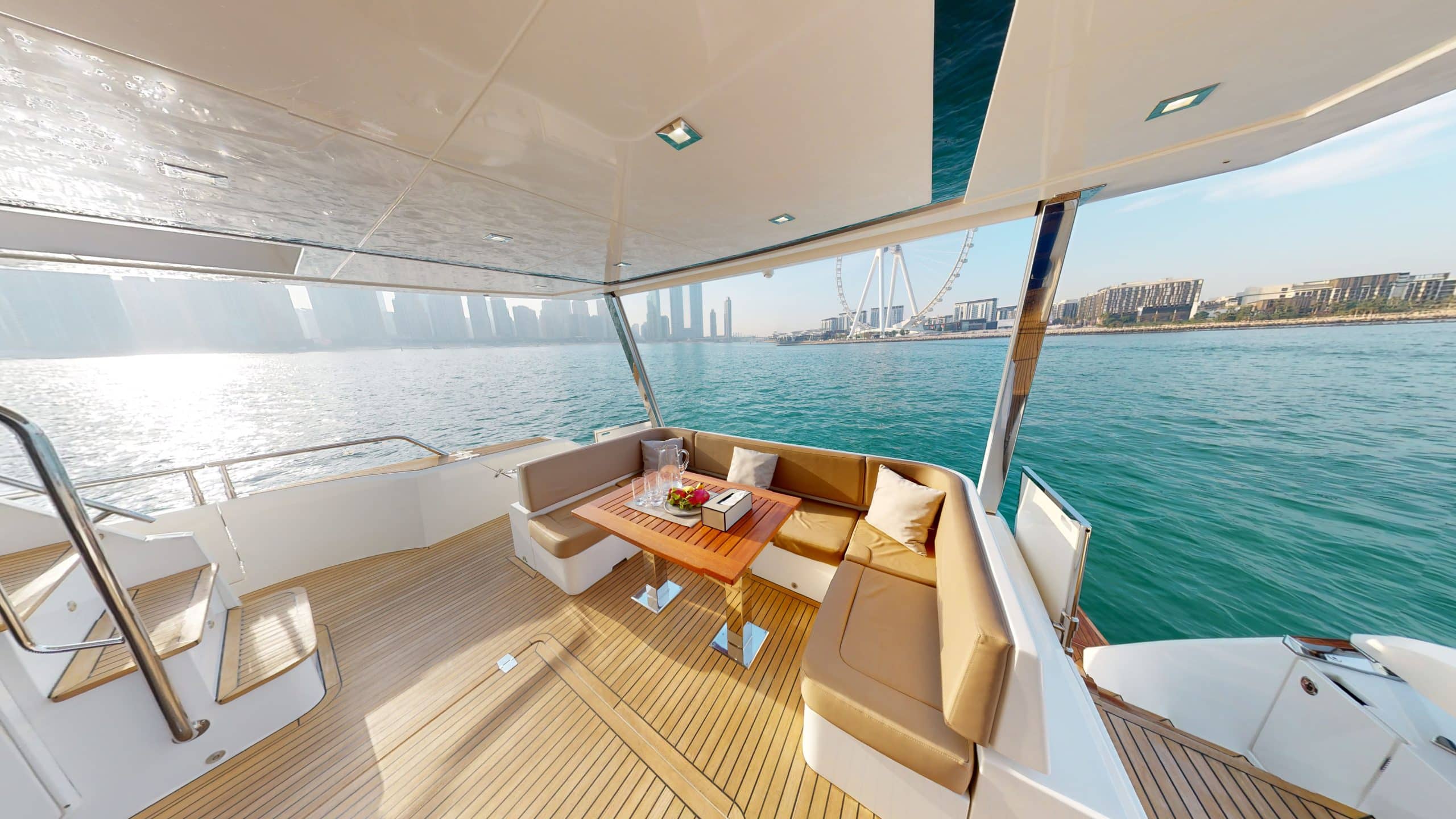 Galeon 780 F1 luxury yacht covered outdoor dining area with sea view